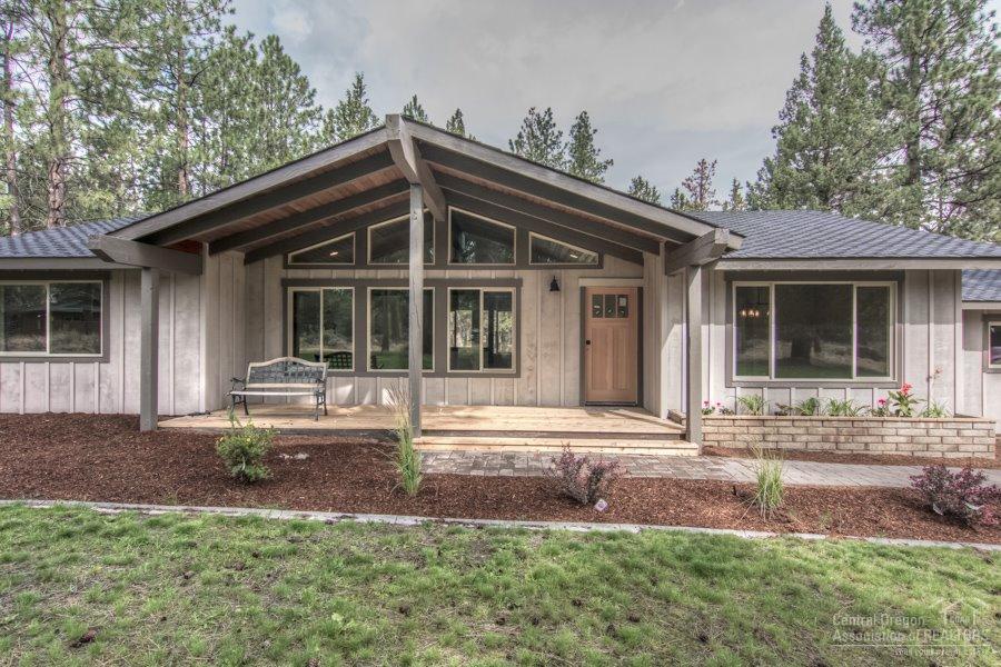 Gorgeous remodel features modern rustic design in highly desirable Saddleback West. Featuring new oak floors, alder cabinets, slab granite counters, energy efficient windows, furnace and water heater. New wood siding, cedar decks, paver walkways, and custom tile shower. This property has all the high end features of a new home on two flat acres deep in the pines. A quiet and tranquil west side property, near Shevlin Park with an oversized detached shop for toys. Listing agent is related to seller.