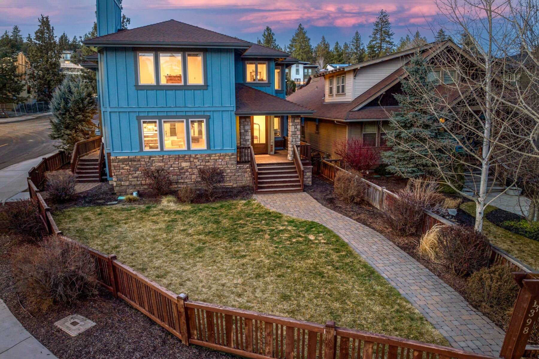 In the heart of the action, this NW Bend retreat offers a rare combination: coveted privacy, extensive renovations, and generous space—an uncommon find in such a prime location. Experience modern luxury in a thoughtfully upgraded home, walkable to downtown, the amphitheater, Deschutes River, and Bend's best dining and recreation. Sunlight pours into the open-concept layout, showcasing a chef's kitchen with quartz counters, custom cabinetry, high-end appliances, and a striking double refrigerator. Fresh paint, new flooring, smart lighting, and a sleek fireplace elevate the interior, while a new high-efficiency furnace, tankless water heater, and updated systems ensure year-round comfort. The expansive primary suite offers a spa-inspired bath, walk-in closet, and seating area, with two bonus living spaces and a main-level office. Outdoors: a fenced yard, enclosed patio, outdoor fireplace, and hot tub. $15,000 buyer credit with accepted offer by 4/30!