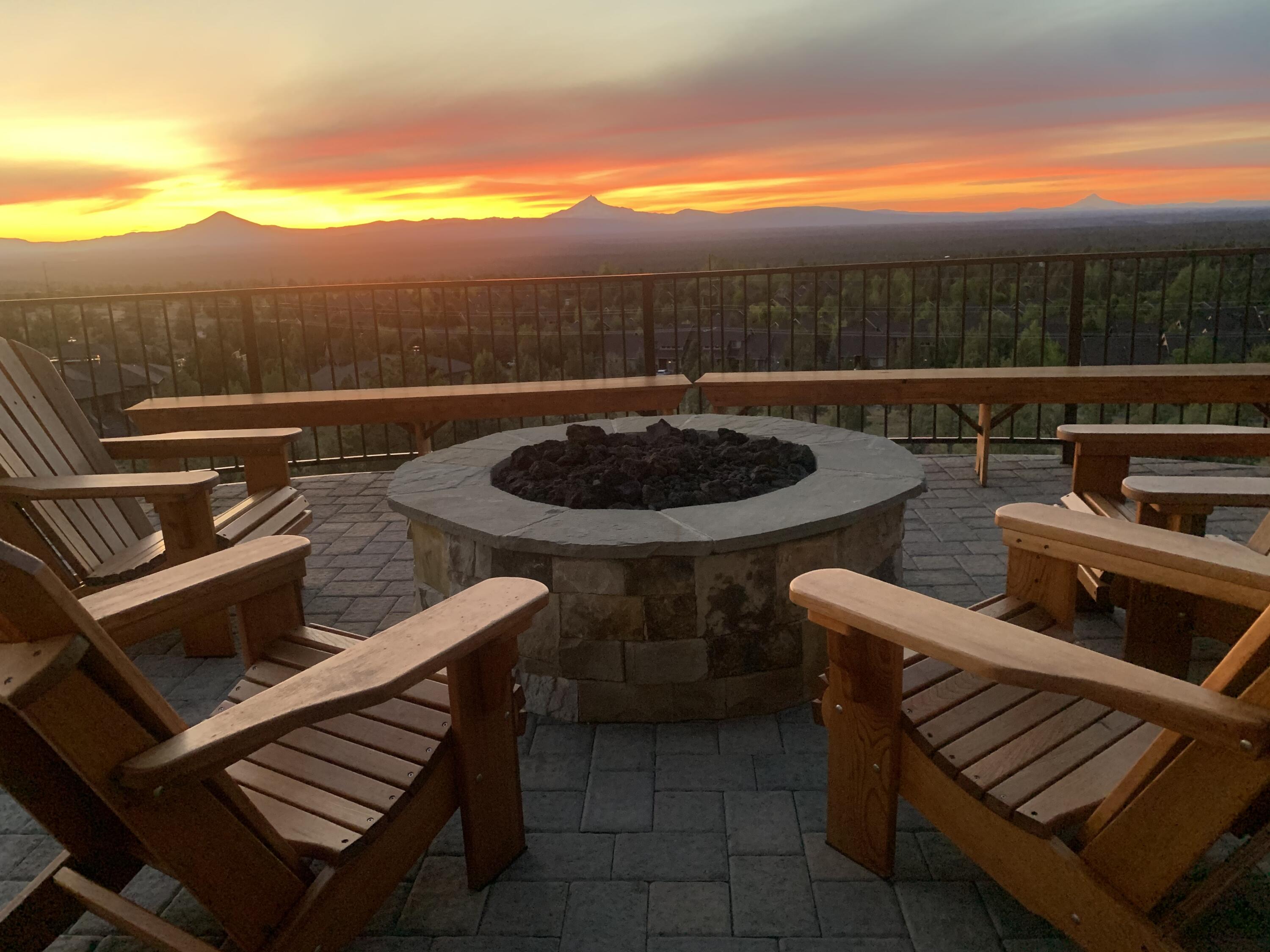 WOW!!  This is a rare view that is absolutely stunning. The views: Mt. Bachelor, Broken Top, The Three Sisters, Black Crater, Mt. Washington, Black Butte, Mt. Jefferson, Mt. Hood, Mt. Adams and Smith Rock!! At sunset, the sky is painted with vivid reds, oranges, and yellows. As the sun lowers they change to a black and gold silhouette that begins to illuminate the 10 mountains and peaks, showing vivid detail of every jagged edge. 
And for the closing part of nature's show,     a spectacular dome of stars. Watch it all on the massive 1500 sq. ft deck!
This single-level open home exudes warmth and quality throughout with hickory hardwood floors, wood-wrapped windows and doors, wood and beam vaulted ceiling, natural stone fireplace, custom cabinets and more. Three bedrooms and 3.5 baths. Two offices with built-in desks. Butler pantry and bar. The garage is extra-large with lots of room for cars and outdoor toys. This home has it all, phenomenal views and privacy and it is truly amazing!!