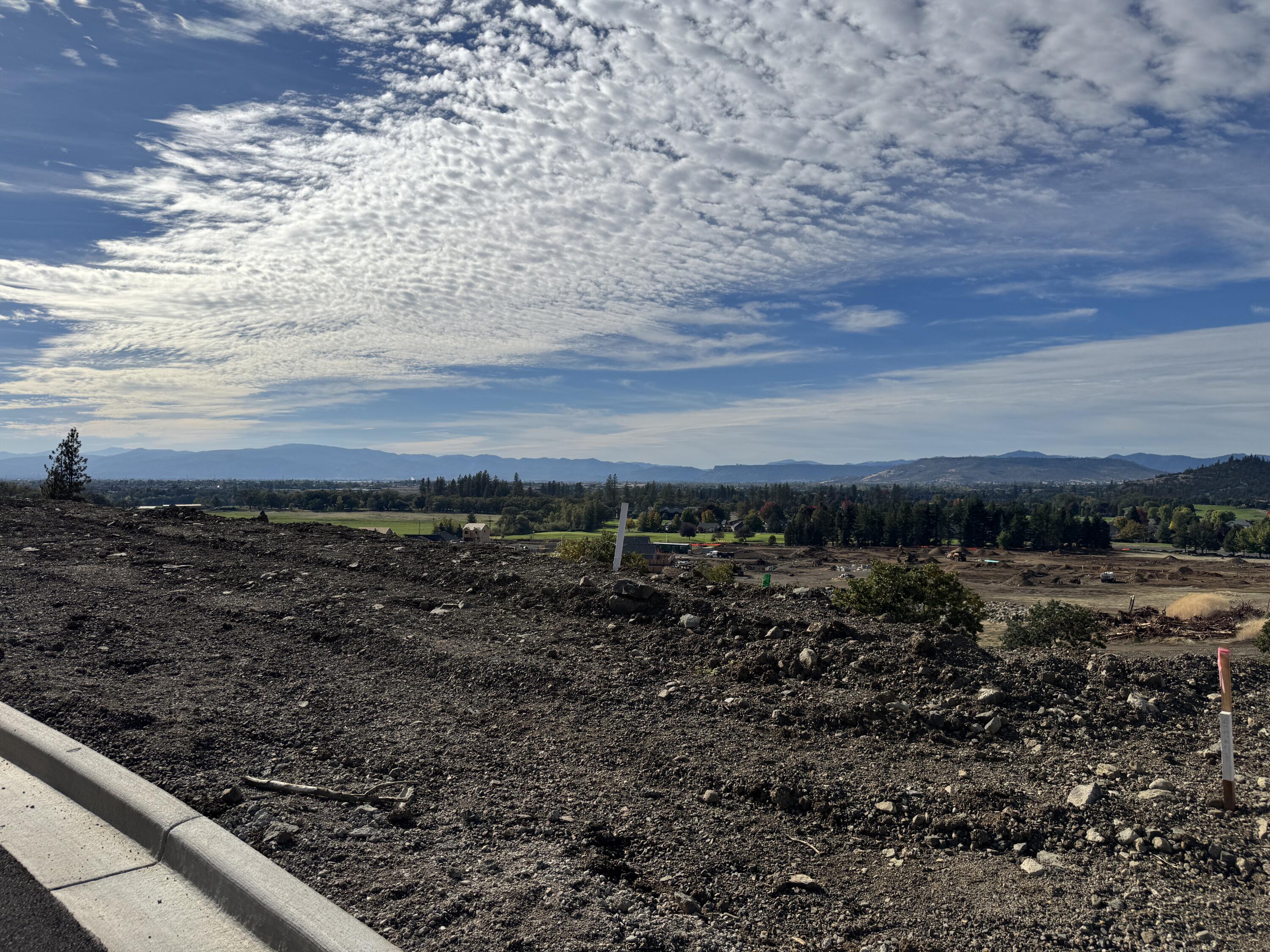 Introducing Quail Run Estates, Eagle Point's premier new subdivision of large luxury estate lots. Discover a rare opportunity to build your dream estate on one of these generous 1-acre view lots, perfectly situated overlooking the renowned Eagle Point Golf Community. These elevated home sites boast breathtaking, panoramic views of the golf course, surrounding mountains, and Rogue Valley. LOT 76