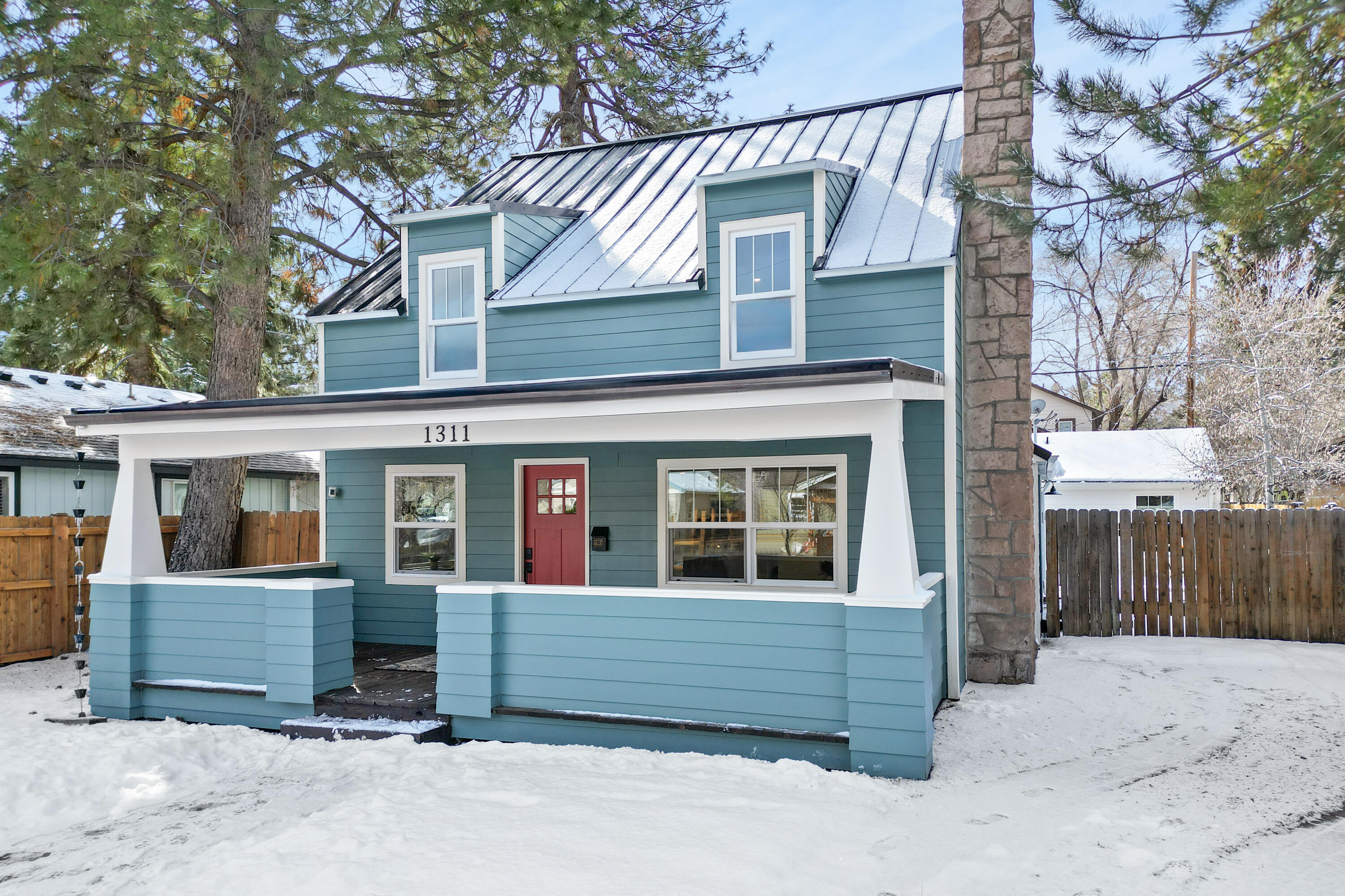 Brand new 1904 craftsman that has been restored to its glory days with all modern upgrades including  forced air, A/C, EV charger, metal roof, plumbing, electric, & reclaimed hardwood floors. Situated in the heart of Bend, use this unicorn property as your urban family home or investment. Investment opportunity awaits with both a grandfathered short term rental permit & detached ADU with 1 bedroom and 1 bath. The main home features 3 bedrooms & 3 full bathrooms with tile work, a spacious family room including a gas fireplace, kitchen with eclectic backsplash, breakfast bar & dining room, & outdoor space. Explore Newport & Galveston Corridors a few blocks from your door. Let this home be both your cozy retreat & basecamp to outdoor adventure with Deschutes River Trail 1 mile away. Investment opportunity, turnkey on Bend's West side, walking distance to amenities, and close to outdoor recreation: truly a unicorn!