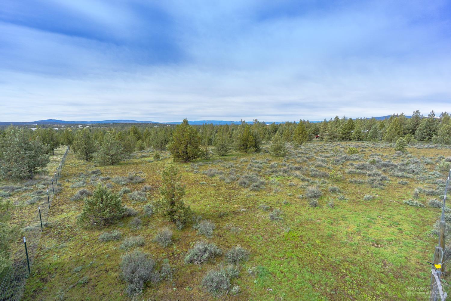 Conveniently located close off Juniper Canyon, this private lot is ready to go! Fully field fenced, gated & ready for horses, a great location to build your next home or vacation spot. Close to BLM & just .2 miles off the pavement. Power is on Coyote Ln & wells are an average of 250 ft deep in this area. Just a short drive to amenities or the lake - come enjoy the view!