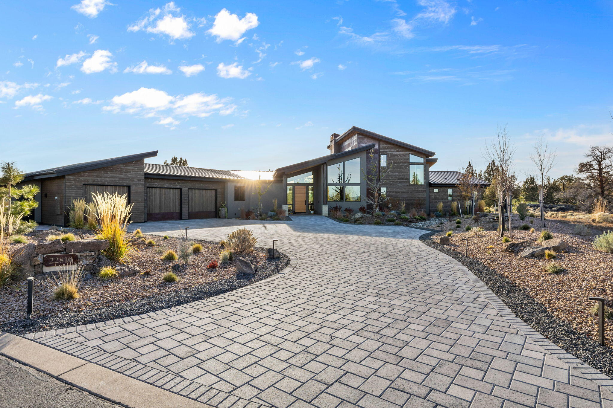 Escape from all the noise & enjoy the tranquility with this private, custom home retreat in the Estates at Pronghorn. This exquisite home was built with no detail overlooked. Cool lines, natural light & timeless design. Great room concept with perfect entertaining & dining space. Chef's kitchen with leathered granite counters, two ovens, wine cooler, walk in pantry. Primary on main level with luxurious bath & heated tile floors. Large office (could be 4th bed) & two other spacious bedrooms. Perfect bonus/media room upstairs with peekaboo views. Lovely outdoor space with built in grill & concrete fireplace to enjoy the fantastic sunsets. 4 car tandem garage with private workout room. This property backs to the 3rd Green on the Fazio course & is set on end of the street on .80 of an acre. Pronghorn offers private Member's club, concierge services, Clubhouse, dining, Day Spa & Fitness Center, Resort & Spa Pools, walking & bike paths, BLM trails & more! Premier Club Membership included!