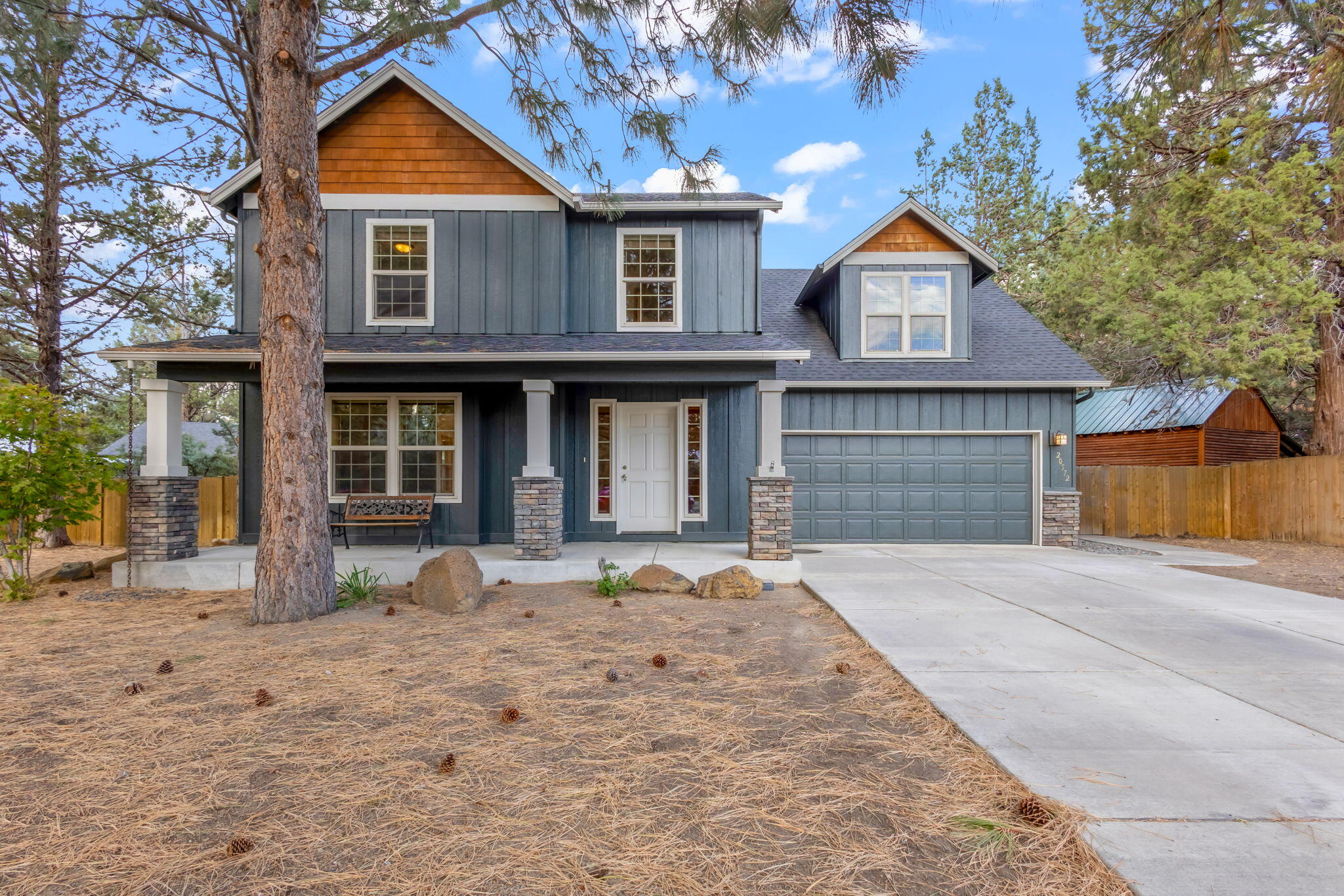 Making its debut on the market, this is a truly move-in ready opportunity. Sitting among majestic large pine trees enhancing its curb appeal and natural serenity, the home features fresh paint inside and out, ensuring a crisp, modern feel. The kitchen boasts new stainless steel appliances and Alder cabinets. Beautiful Hickory floors flow throughout the main living areas, adding warmth and durability. A spacious fourth bedroom offers incredible flexibility and could serve as a bonus room, home office, or a second primary suite. The primary suite with walk-in closet and the bathroom featuring a tile step-in shower and luxurious travertine flooring. This home blends modern comfort and style with natural beauty and versatile living spaces, representing a rare find for its next owner.Home warranty offered with accepted contract