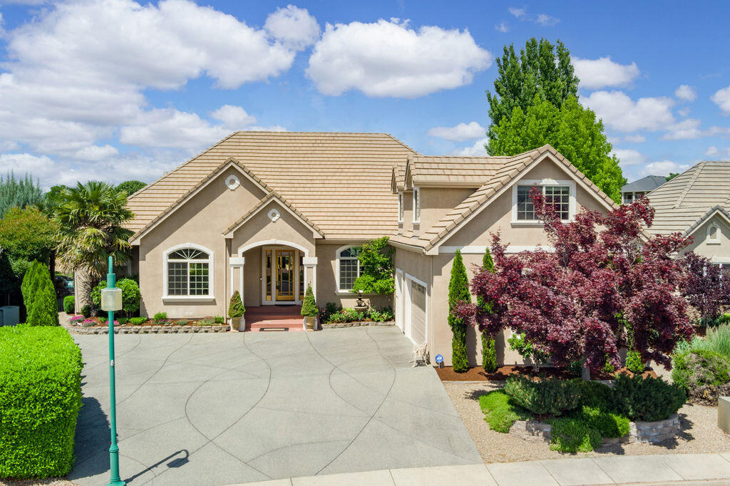 Eagle Point Golf Course overlooking the 4th Fairway w/a Pool! Gorgeous home with all the updates you are looking for. Soaring high ceilings & lg windows to take in the views! 8' tall doors, stone & hardwood floors, floor to ceiling stone fireplace in the great rm that is open to the kitchen w/island & 2nd sink, w/dbl ovens, 5 burner gas cook top, granite counters & pantry. Primary suite w/walk in closet, see thru gas log fireplace, lg tile shower w/duel shower heads, dbl sinks, jetted tub, water closet & slider that takes you to the back covered patio overlooking the beach entry lagoon heated pool w/water feature. Rod iron fenced backyard w/beautiful EZ care landscaping. 4 bdrms, 2.5 baths all on the main level. Upstairs bonus rm above the 3 car garage. Pride of ownership shows! Perfect quite cul-de-sac location close to hiking trails, clubhouse & pro shop.