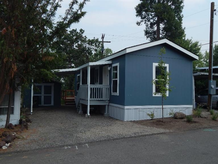 It's BRAND NEW and waiting for its first owner. It's not often that you get to be the first person to live in a home in Bear Creek all-ages park just outside Ashland. This 2015 Fleetwood is the perfect size for one or two as a vacation home or settle in all year. High ceilings, an open floor plan and big windows make this cozy home feel much bigger. The bedroom is in the back of the home and takes advantage of the views. The home comes with an underground sprinkler system, carport, storage shed and a fabulous back deck that overlooks the park's open space. It is a private and peaceful outdoor room. This home is so new that taxes indicated on the listing information are an estimate only since they have not yet been determined.