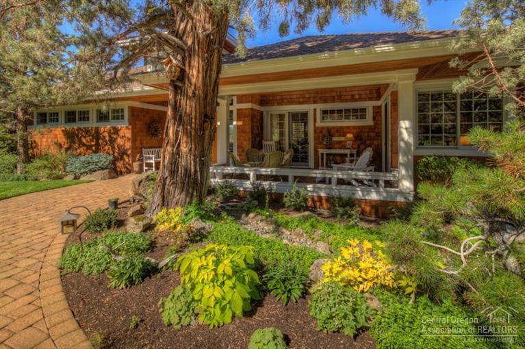 The serenity of nature surrounds you in this architecturally exquisite cottage design on one acre above the Deschutes River canyon. A welcoming, covered front porch opens to a grand foyer and the perfect great room, single level floor plan. Large picture windows capture the breathtaking Cascade mountain views. Drenched in light, the chef's kitchen offers top line appliances. Private and bordered by the river trail & park land, this is a slice of heaven on earth! Immaculately maintained inside & out.