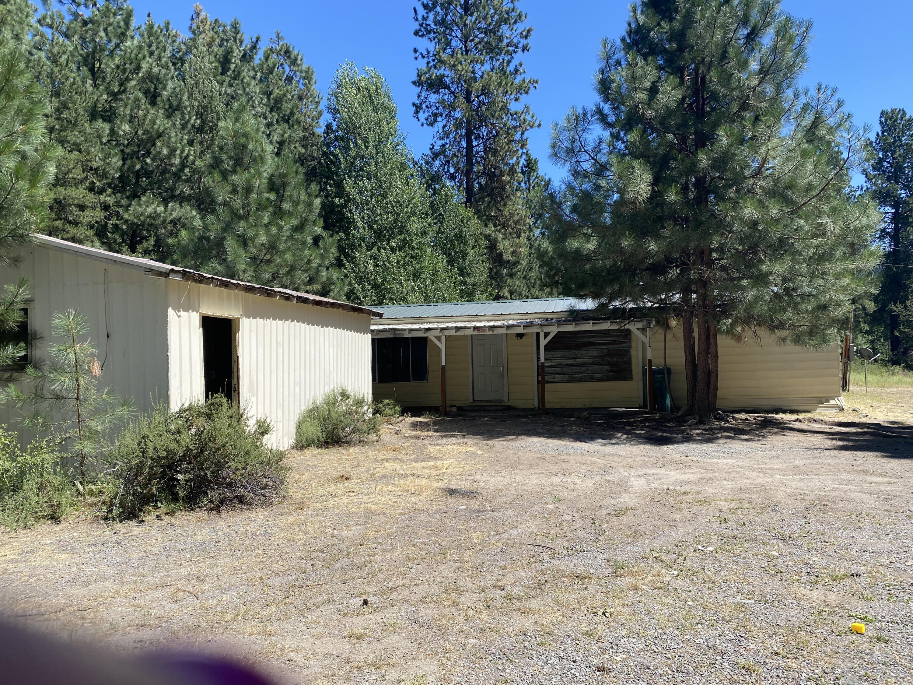 Opportunity KNOCKS ! 
Take a look at this fabulous 8.23 acres in Fort Klamath
40x40 shop, additional garage, and several other outbuildings. 
The home could be repaired with a lot of work or a TEAR down 
Lots of timber on this property, and very private.