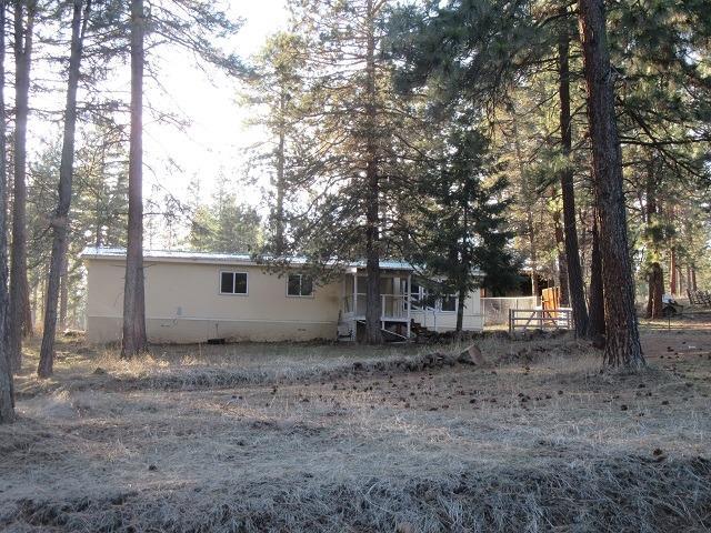Keno- 1976 Double wide MF with Nice Metal Roof on 1 Acre in the Pines. Has septic & well it shares with uphill neighbor.Forced air natural gas heat. Needs new power pole & meter, appliances and cosmetic fixing. Being sold as is. Cash only.