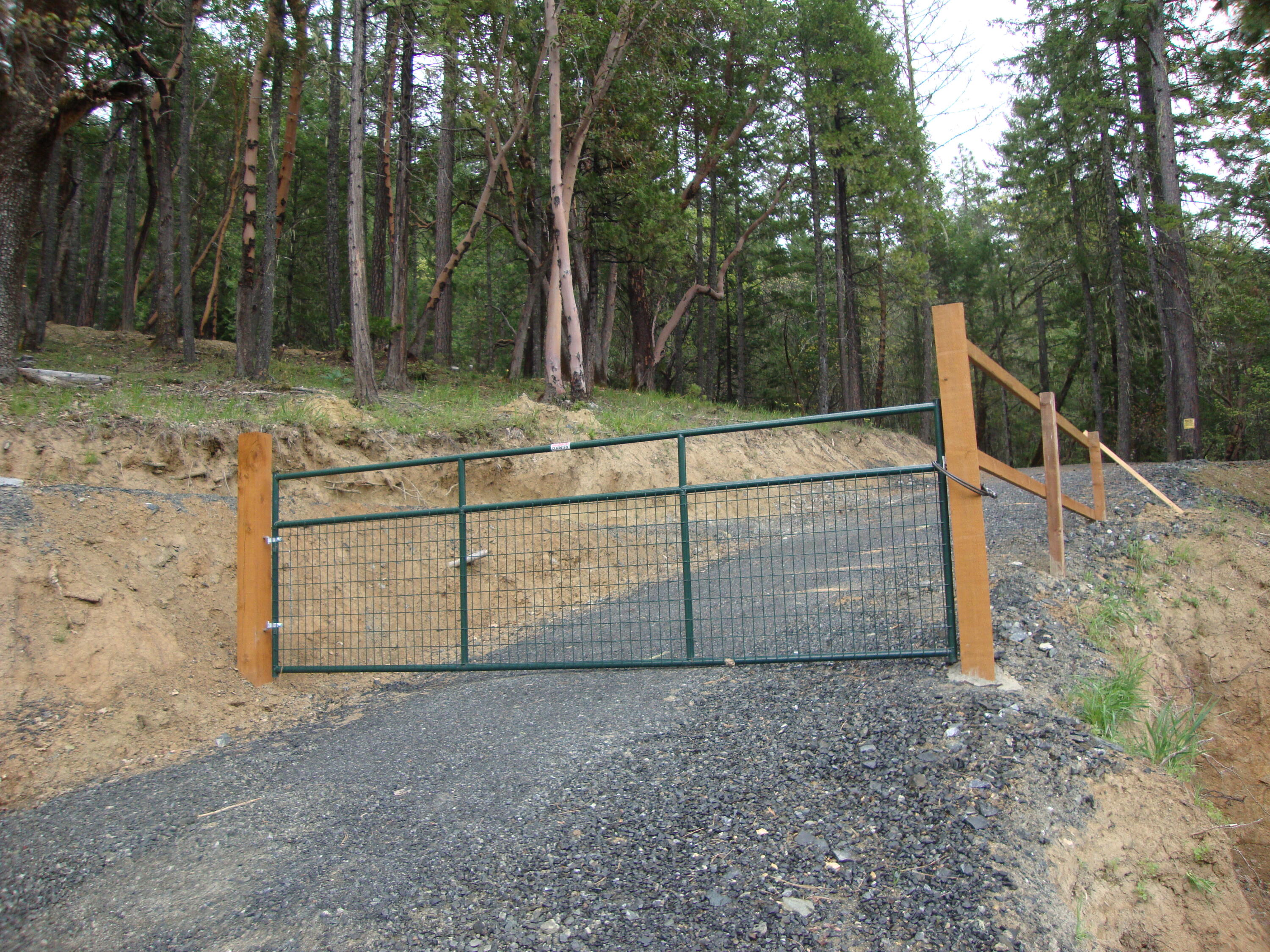 11.7 wooded acres with Homesite approval for sale. Water, Electricity and 4-bedroom home approved septic is installed. There is in place a 2000 gallon holding tank with pump house and the water is sourced from a 10 GPM shared well. This property backs up to BLM on 2 sides. Buyer to perform Due diligence.  Second property available, make an offer on 1 or both properties.