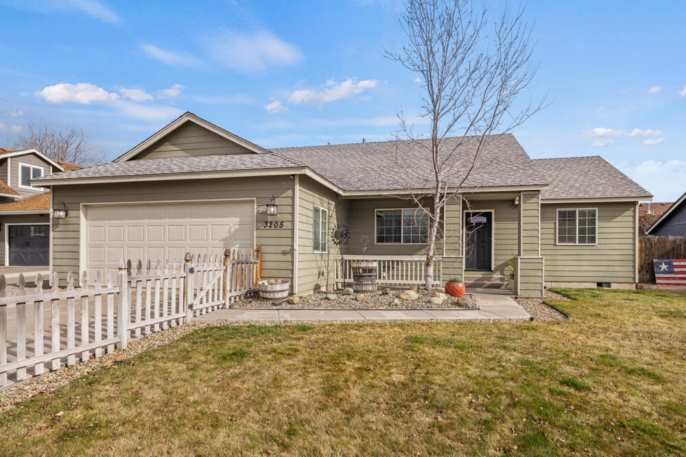 This adorable 4 bedroom, 2 bath home has been well cared for & loved over the years! Featuring a great open floor plan with vaulted ceilings, brand new luxury vinyl plank flooring & tile. The kitchen is updated with new granite counter tops, backsplash, farm sink & faucet. Matching stainless appliances & pantry. The primary sweet is separate from the other bedrooms feat an updated bath with double sink vanity, trendy backsplash, tile floors & great walk-in closet. The 4th bedroom could also be used as a bonus room or office space. Other updates include a new hybrid natural gas furnace & heat pump/AC unit. New fixtures throughout. Relax on the back patio or covered front porch. Fully fenced front & back yards, landscaped with drip system & sprinklers. Separate raised bed garden area, storage shed, plus graveled RV/additional parking off the garage. You will not want to pass this one up!