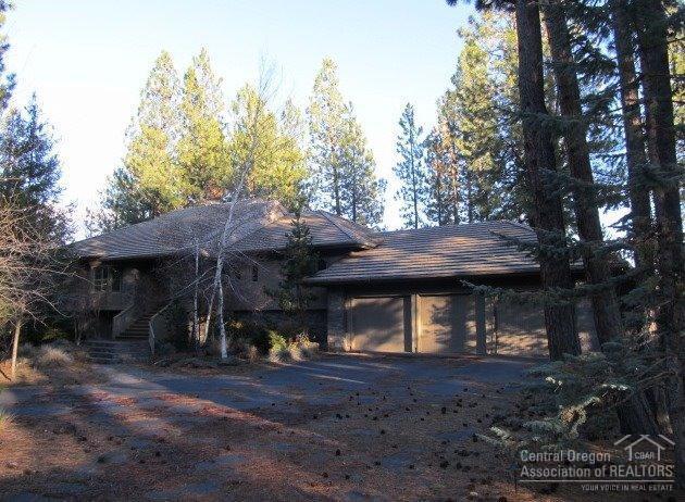 Wonderful Broken Top home situated on a large, private cul-de-sac lot features spacious open design, open beamed vaulted ceilings, floor to ceiling stone fireplace, master suite with a library/office, see-through gas fireplace, fabulous master bath, many built-ins throughout, media/game room, extensive decking, 3 car garage with vast amounts of storage.