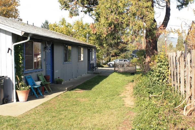 Great investment opportunity centrally located in Grants Pass. Well maintained duplex; both with 2 bedrooms, 1 bath, laundry hook-ups, central heat and air, range/oven, dishwasher and a private patio. Each unit has separate electrical meters. There is a large shared backyard with fenced garden area and 4 off street parking spaces. Newer appliances, flooring and paint. Both units are currently occupied. Easy access to I-5, downtown, public transportation, schools, shopping and medical facilities.