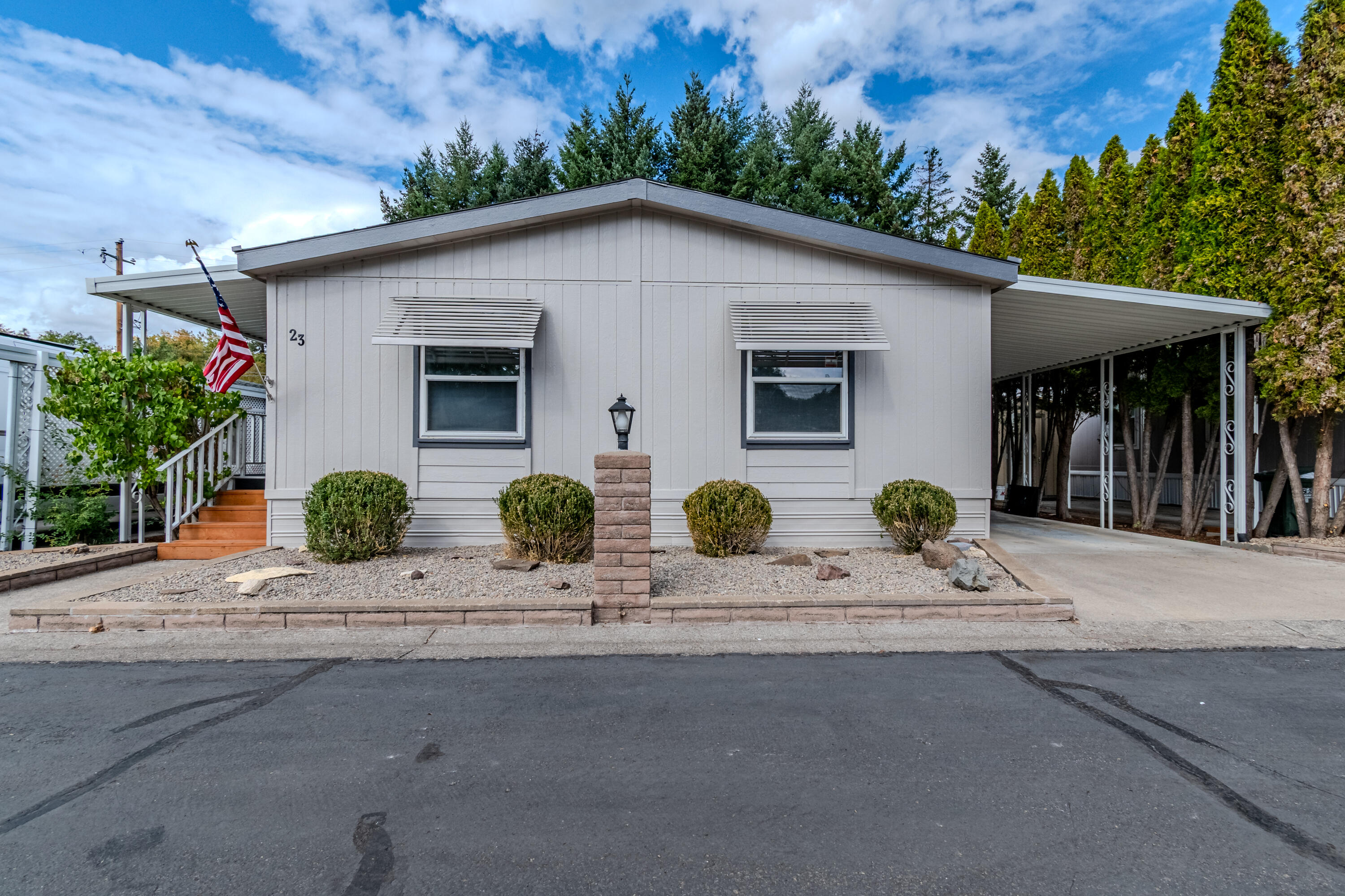 Grab your fishing pole. Leisure days is a wonderful 55plus park in beautiful Shady Cove. It fonts the river and has a dog park. This 1993 Guerdon MH has 3 bedrooms and an office, new paint in/out, new roof, new water heater, remodeled bathrooms, new dishwasher, new garbage disposal, has been replumbed (no polybutylene), all new flooring even on the deck. New outdoor stairs from deck. Water, sewer and trash are included in park fees. A home warranty is included.