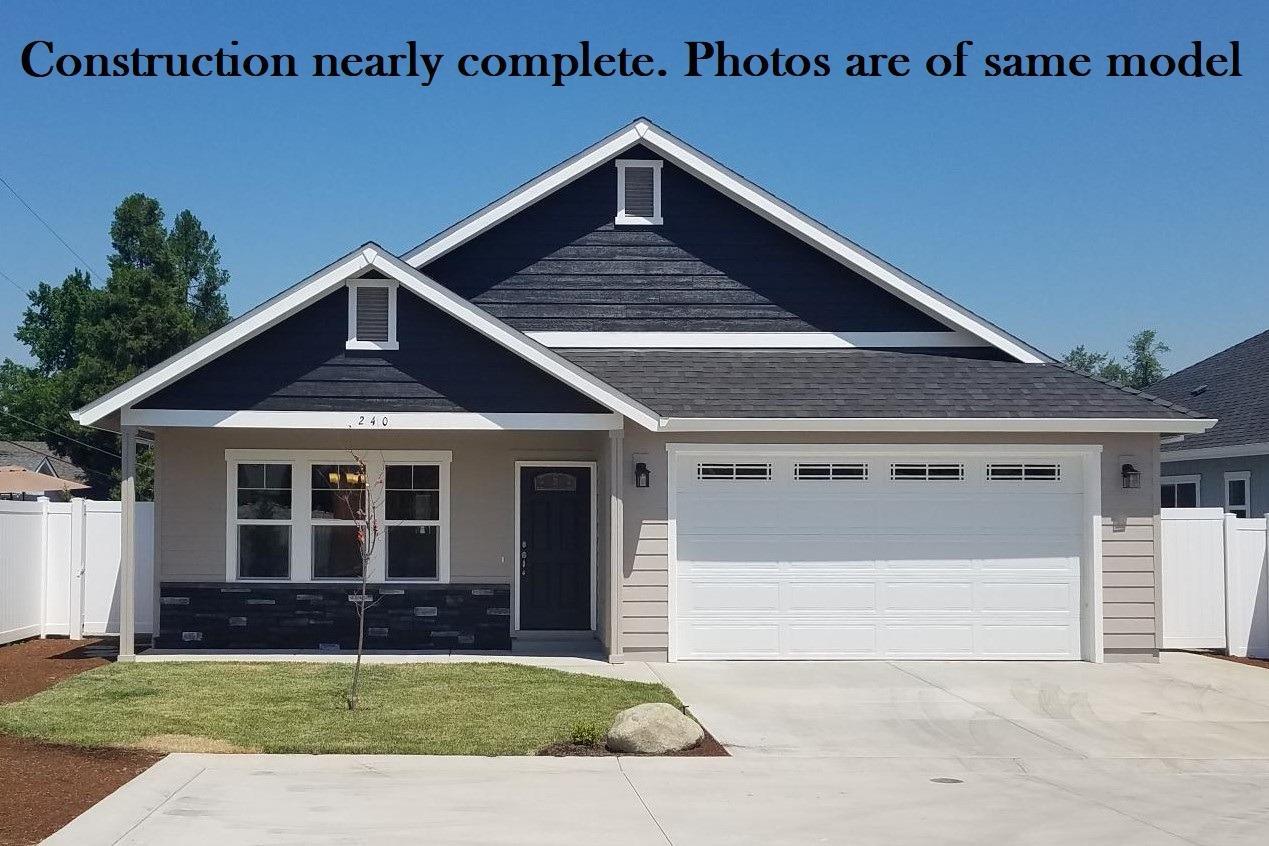 Brand new home in Blackberry Lane Subdivision. So new, the streets are not on most maps yet! Estimated completion date - 09/10/19. PHOTOS ARE OF SAME MODEL. Home includes 9 foot ceilings throughout, granite counters & lots of extra storage. The granite breakfast bar kitchen with custom hickory cabinets & huge pantry includes stainless steel appliances with microwave hood over the gas range/oven. Master bedroom and bath with dual sinks and large walk-in closet. There's a spacious garage with upgraded 8 foot high garage door, a laundry sink and premium, no maintenance, white vinyl fencing. Country location close to Schroeder Park on the mighty and majestic Rogue River with rural feel yet with city services and District 7 schools. A no marijuana grow zone, Blackberry Lane is a designed, Pocket Neighborhood-style development for enhanced living enjoyment and sense of community. Zero down, 100% USDA financing available! 10 Year Builder's Warranty included! CALL TODAY!!!