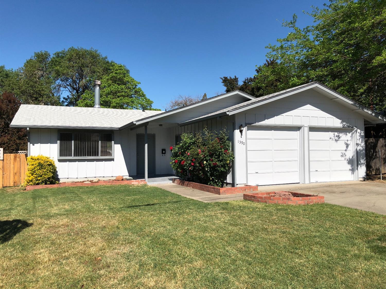 Located in NW Grants Pass, area of nice older homes. New flooring thru-out, freshly painted interior and exterior, finished garage with garage door openers.Fully fenced backyard with deck and RV parking. This home is move in ready.