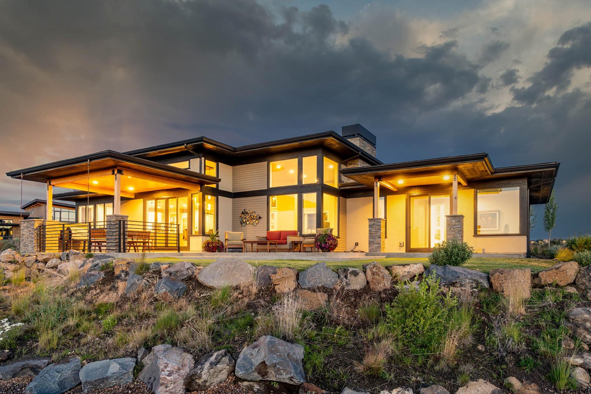 This contemporary home offers Cascade views, large windows, engineered hardwood floors, & soaring ceilings throughout. The great room features a gas FP and corner windows that frame the mtn views. A dining area connects the great room and kitchen, which offers quartz countertops & high-end appliances, including a 48-inch Miele gas range and two Miele ovens with steam options. Kitchen also includes an expansive pantry. On the opposite end of the home, pass the office on the way to the primary suite, featuring a patio and a spa-like bathroom with soaking tub & tile double shower. Upstairs, find a large open bonus area and flex room. Also on this level are two full guest suites w/ walk-in closets, large bathrooms, & ample sunlight. This home also includes a large laundry room off the mudroom & a 3-car garage with shop space and built-in storage. This home offers access to the trails, dining, and amenities that make the award-winning Tetherow Resort a wonderful place to call home.