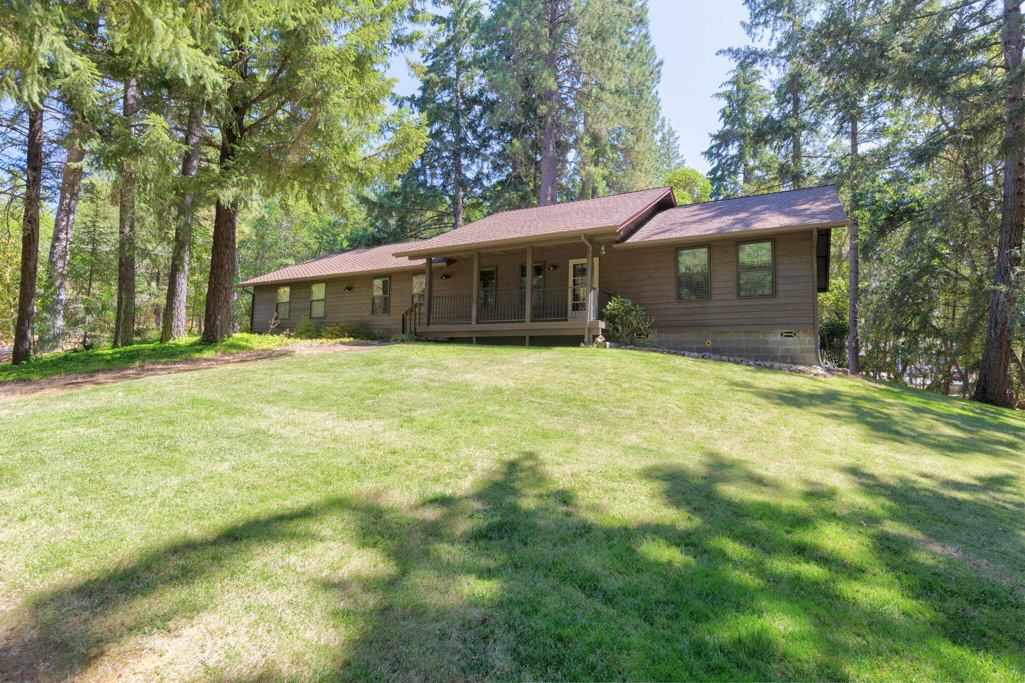 This 3 bedroom, 2 bath home is perfectly situated on 2.99 lightly wooded acres with electric gate & gently sloping paved drive which provides room for all your cars and toys.   The 2-car finished attached garage has an additional room for extra storage.   The detached 24x24 finished and insulated garage and/or workshop has a certified pellet stove and roll-up door for easy access, plus there is RV parking with 50-amp service. The well-maintained home has many updates including the extra-large primary suite with remodeled bath with large walk-in tile shower, double vanity, heated floor, and solar tube.   The kitchen includes stainless appliances, natural cherry cabinetry, quartz counters with tile backsplash and a perfect breakfast nook.  The living and dining room are spacious with woodstove with custom hearth and mantle, lots of windows and slider to the new trex deck. Natural landscaping & inground sprinkler & timers, make this a low maintenance yard. FA Eagle Premier Buyer HW.