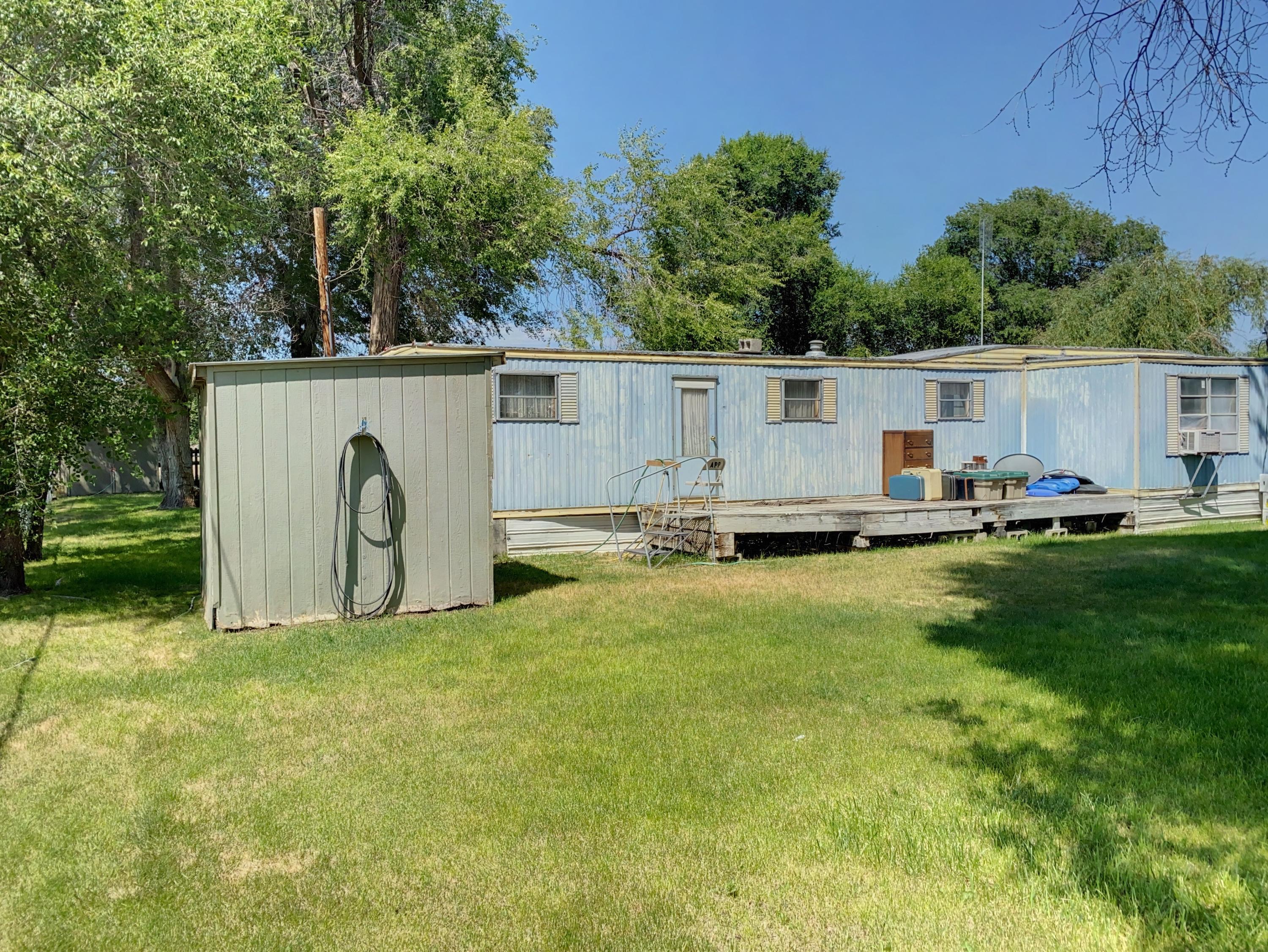 Ready to build your dream home? This property is 1.58 acres with 2 wells, septic and power in place in a great location. Currently has a single wide 2 bed/1bath on it.