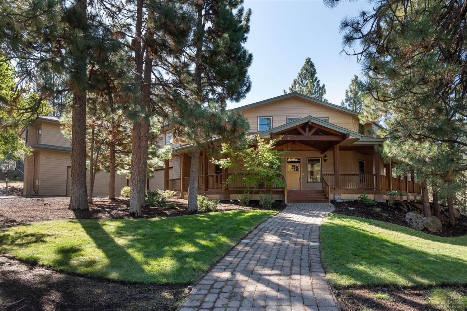 Beautiful Awbrey Butte home, private cul de sac, almost an acre of parklike yard. Covered front porch welcomes you and offers great outdoor living. Spacious and bright great room, perfect for entertaining, chef's dream kitchen boasts a large island. Main floor office and full bath. Upstairs master has a fireplace and private deck with peakaboo mountain views. Huge bonus room with bar area, plus 3 guest bedrooms. 1900SF garage fits 4+ cars, bring your toys!<br>