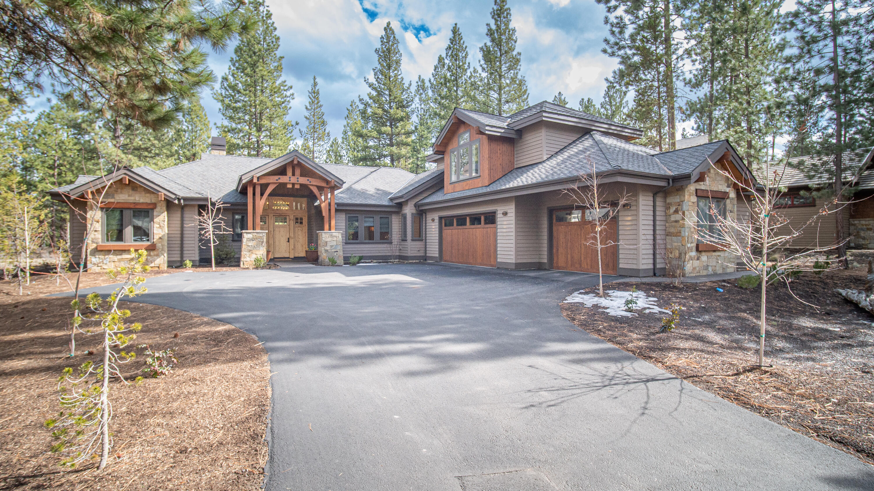 This Modern Mountain home architecture is minimal in style. It stunningly complements the surrounding forested environment. This custom design centers on using natural materials fashioned into sleek and minimal shapes. Modern and simple in style it also features some rustic elements like wood wrapped beams and an exquisite stone fireplace. This home features large seamless black lacquered Andersen wood windows that stunningly accent the light interior. White oak floors and cabinets, 8' solid fir doors. Main floor living with spacious bonus/bunkroom, full bath and wet bar upstairs. Oversized 3 car garage with electric charging station. Outdoor living includes forested Fireglass Lake and stream views. From the patio enjoy dining or the cozy built-in fire pit. Follow the trails to the Caldera Springs Lakehouse, Quarry pool & Fitness Center, playground, sport courts, and Caldera Links and Golf Park truly minutes away. 
Visit: www.calderasprings.com
for Community, HOA, and Expansion info