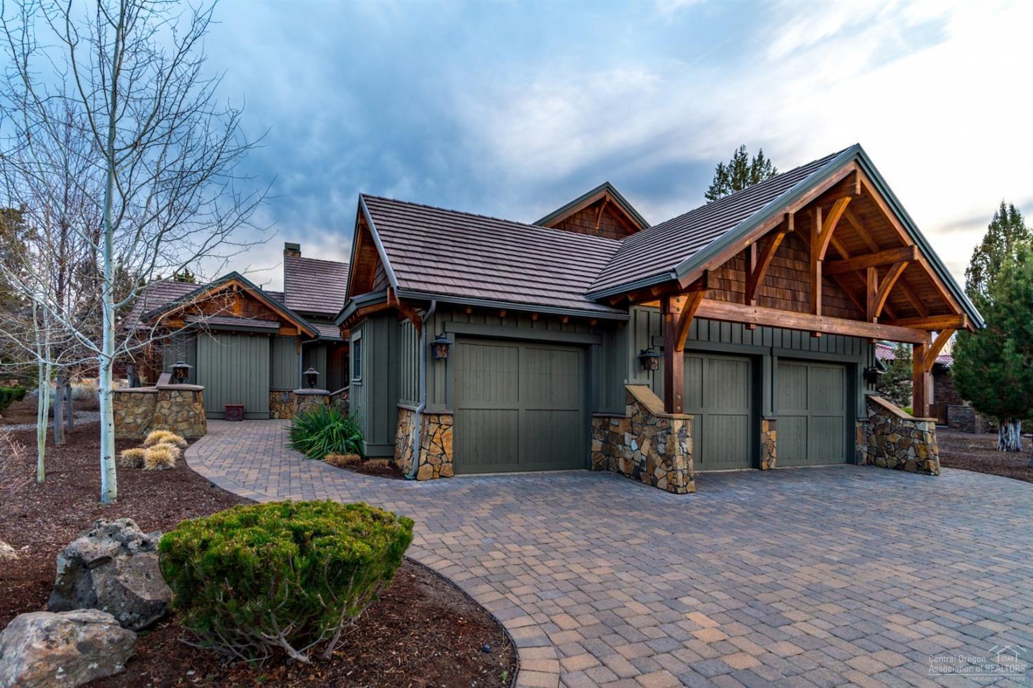 Gracious open living w/ custom features throughout. High vaulted beamed ceilings, rock fireplace, fabulous gourmet kitchen w/ top of line appliances, custom cabinetry, slate flooring & granite countertops, plus separate granite bar. Large master & 2nd bedroom on main level & 2nd story en suite bedroom, spacious office, patio w/ spa/hot tub & gas fireplace. Wonderful entry terrace w/ cozy gas fire pit & room for cars and toys in the 3 bay 967 sq ft garage. Seller to credit $60,000 towards buyers golf membership.