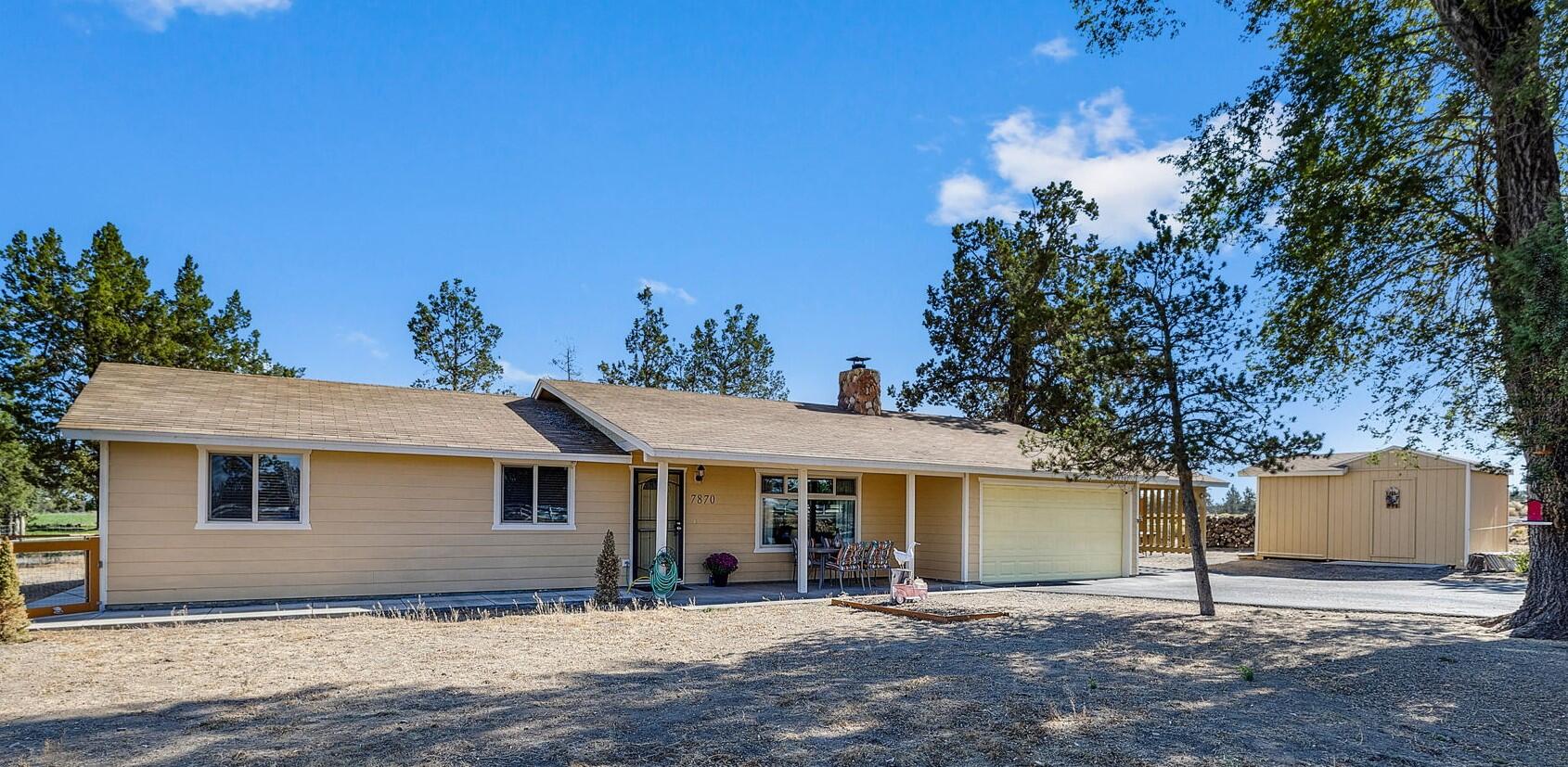 Don't miss your chance to own this rare small acreage property, conveniently located in SW Redmond. This charming, well-maintained home features a vaulted ceiling in the living room with exposed beams. You'll find numerous updates throughout, including a fully fenced yard, new kitchen cabinets, countertops, and appliances. The living room boasts a new electric fireplace, and new ceiling fans have been added in the kitchen, primary & living rooms. Enjoy new flooring in kitchen and living spaces and rest easy knowing a new well was just installed last year. This home has a large storage shed and covered carport in addition to the 2 car garage. With an acre of land there is plenty of space to park an RV & all your toys. Create your own backyard oasis, whether it's a garden, a small hobby farm, or simply a space to relax. Pride of ownership shines in this turnkey property. Buyer to do their own due diligence regarding all aspects of this property.