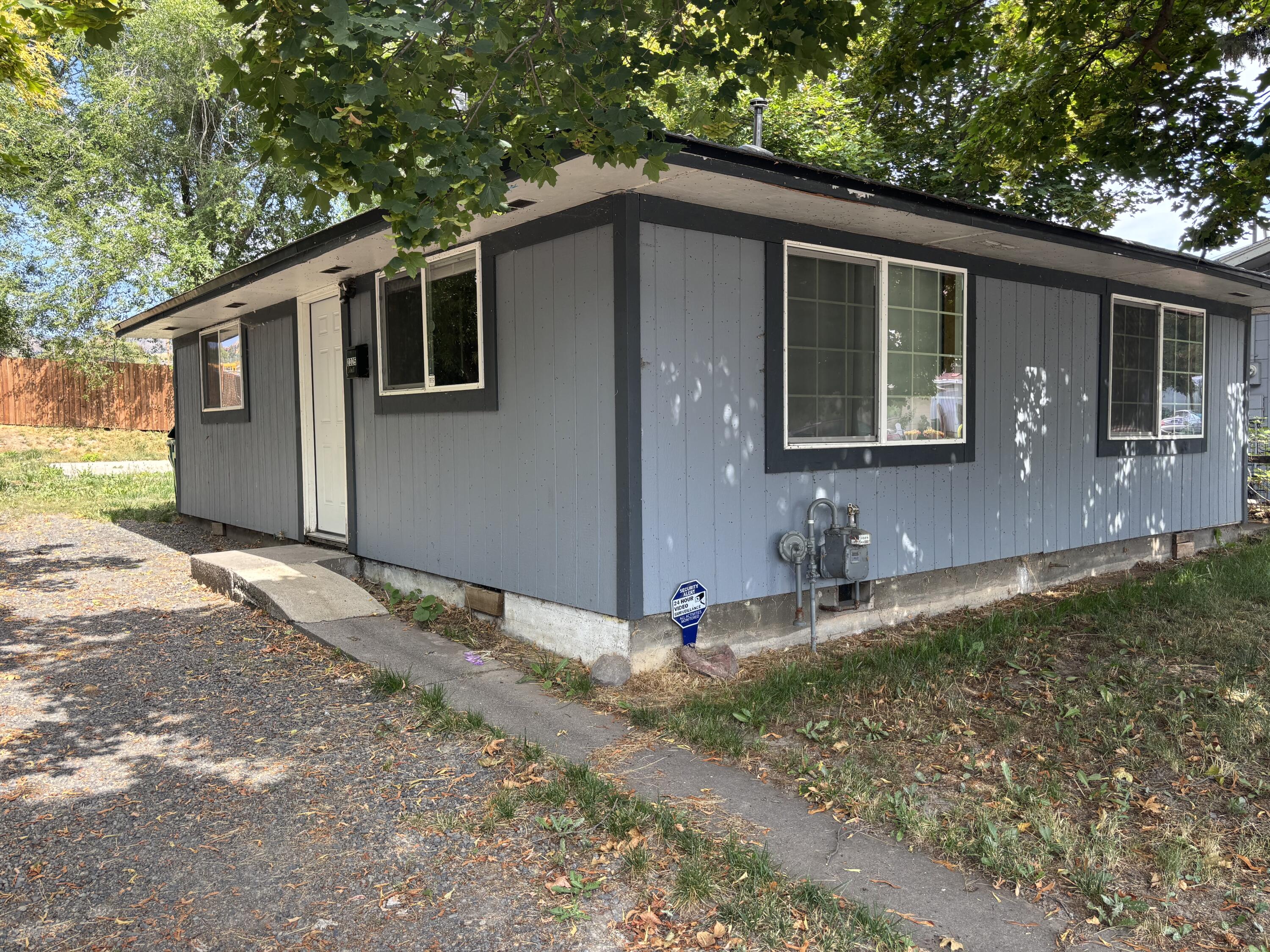 Super cute 2 bedroom 1 bath home next to the bike trail. Centrally located home with newer roof, flooring, kitchen and bathroom.  Beautiful hardwood floors.  Gravel driveway with ample parking. Established trees for nice shade.  Seller has done a recent price reduction as it does have termite damage on the sill plates and subfloor areas under the home.