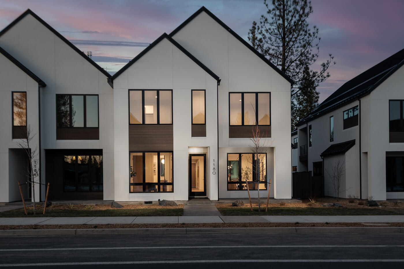 Trove Townhomes at Discovery West. This collaboration between COBA Award-Winning builders Structure Development NW and Curtis Homes LLC bring Scandinavian-inspired modern designs to Bend's desirable westside neighborhood. Clean lines and contemporary finishes, open floor plan and extraordinary living space. Great room with gas fireplace and hardwood floors. Spacious kitchen, professional appliances, large island and pantry. Dining area and covered patio perfect for entertaining. Guest suite on main level. Primary suite on upper level with vaulted ceiling, tile shower and walk-in closet. Two additional bedrooms, full bathroom, loft, laundry room and covered deck. Two-car garage and fully landscaped. Located in close proximity to future Discovery Corner Plaza, a vibrant mix of storefronts, gathering spaces and venue for neighborhood events. Easy accessibility to popular walking and biking trails. Trove offers carefree active living in this outstanding Discovery West location.