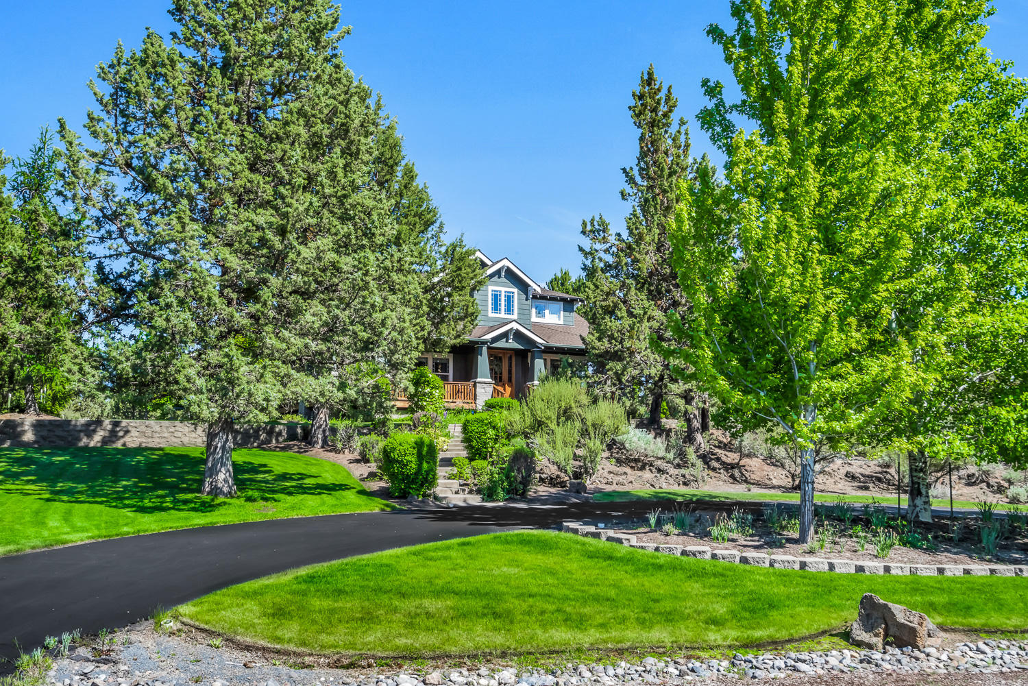 Beautiful and meticulously cared for small acreage estate bordering the city limits.  Country living in town, this quality craftsman home sits nestled among the trees on a very private 2.84 acres. The property lives like a quiet, safe retreat within a community of just 8 homes while being only minutes from both downtown Bend and the Redmond Airport.  High end construction, appliances and finishes throughout.  Gourmet kitchen, 5 bedrooms, 6 bathrooms, 2 large master suites, 1 junior suite, large bonus room and 2 laundry rooms.  Main level master could be a mother-in-law suite with a private separate entrance and den.  Level building site to build a dream shop and studio.  Recent upgrades include a new GAF Timberline roof with 25 year warranty, sectional garage doors, automatic sprinkler system, kitchen appliances, A/C condenser, Aprilaire Air Purifier and much more.  For a complete list of upgrades please see the attached improvement list.  This one-of-a-kind home is truly a must see.