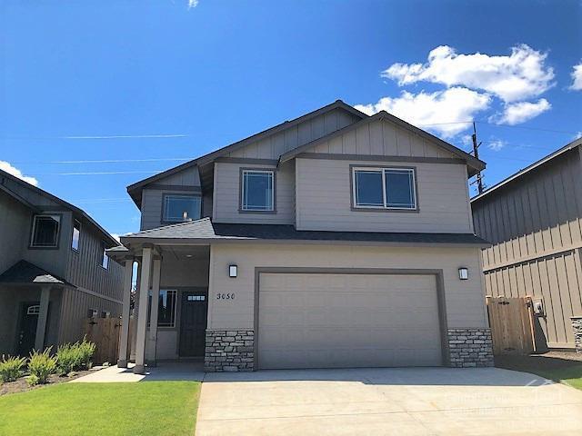 100% complete & move in ready! 4 bedroom, 2.5 bath, 2,415 sf open living space. Lg great room w/gas fp open to Dining & Kitchen w/eating bar. Modern cabinet package, Quartz slab counters, full tile back splash, SS Energy Star appliances. All br's up along w/laundry. Huge Master w/walk in closet, dbl sinks in both baths. Gas forced air w/high efficiency furnace & A/C ready. Triple, tandem car garage. Front Landscaping w/ auto sprinklers, fully fenced & pet ready. Model home @ 3095 NW Alder Pl Thu-Mon 12-5pm