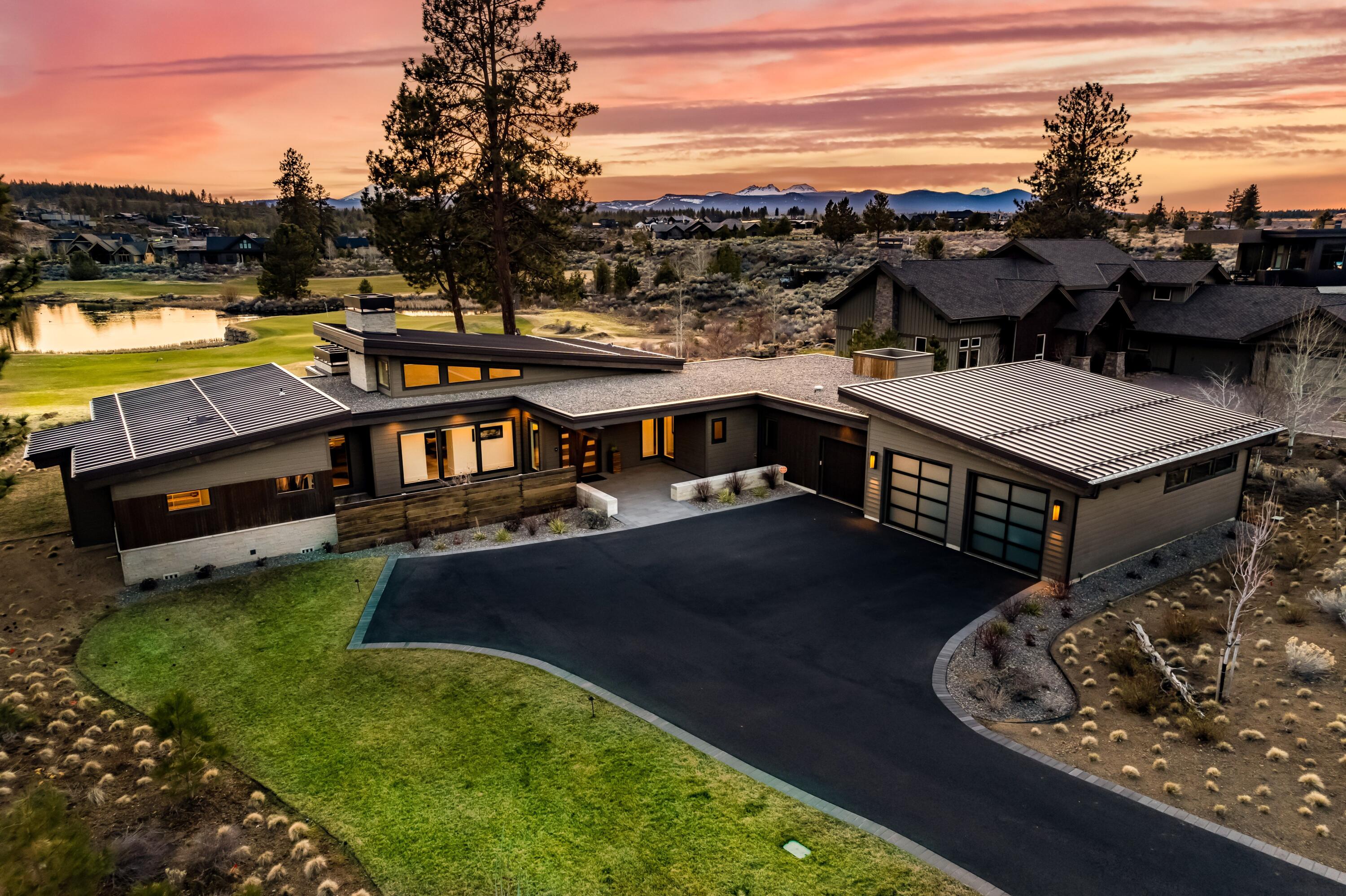 Beautiful single level custom built home with mountain views on Tetherow's 13th green overlooking the pond.