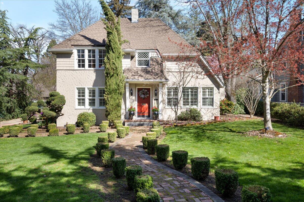 This enchanting storybook home boasts unique architectural details, including 3 gas fireplaces, arched doorways, beautiful handcrafted woodwork & built-in cabinetry, just to name a few. Warm & inviting living room w/abundant natural light. Kitchen has custom cabinets, quartzite counters, island, built-in refrigerator, breakfast nook & secret door that leads to the wine cellar in the pristine basement. Spacious main level master suite w/a spa-like en suite bathroom, featuring a deep soaking tub & elegant finishes. Upstairs you will find a spacious bedroom w/gas fireplace, cedar lined closets & door to huge upstairs outdoor space. 2nd guest bedroom & office are beautiful & filled w/natural light. Detached oversized 3 car garage w/bonus room upstairs. The private backyard is a serene oasis, complete w/deck, water feature, pavilion & quaint paths that evoke a sense of tranquility. Perfect for those seeking a fairytale retreat, this home combines old-world charm with modern comforts.