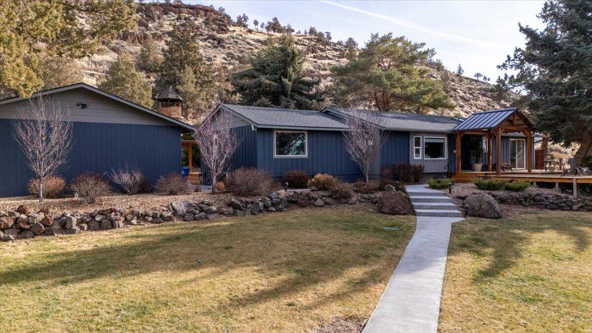 Step in to your dream home, built in 1975 and completely remodeled-This beautiful ranch-style property is nestled on 2.53 acres just minutes from town. Every detail has been thoughtfully updated-from open concept living area to stylish kitchen updates. With a primary suite, junior suite and 2 addtl bedrooms, the layout is both functional and inviting. Outside you will find new decking and ample outdoor space to roam, bring your animals and other hobbies! Home features a detached garage and a shop that is ideal for hobbies, storage or work with the two complete offices spaces. Dont miss your opportunity to own a move-in-ready home with acreage and all the extras!