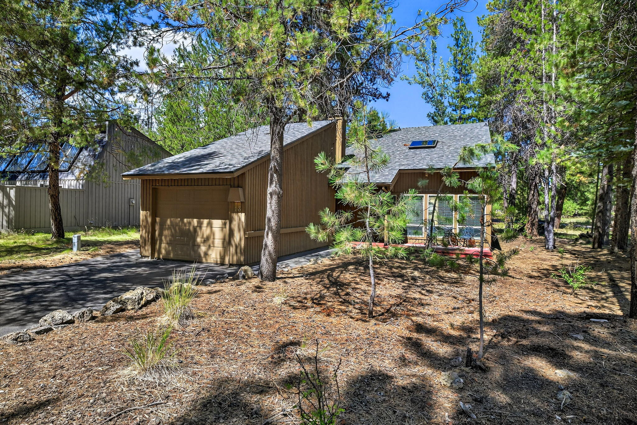Beautifully remodeled and sold turnkey, this 4-bedroom Sunriver retreat features a spacious loft for extra sleeping, high-end furnishings inside and out, fully updated kitchen, bathrooms, appliances, flooring, paint, new roof, 65 inch TV, cieling fans,  and hardware and so much more. Designed for comfort and style, the open layout and oversized deck offer room for the whole family to gather and relax. Just steps from Fort Rock Park and a short bike ride to the SHARC Aquatics Center, this home is perfectly located in the heart of Sunriver. Whether you're seeking a personal getaway or a strong investment, this property boasts a proven vacation rental history. Enjoy all that Sunriver has to offer in a move-in-ready home that blends comfort, convenience, and charm.
