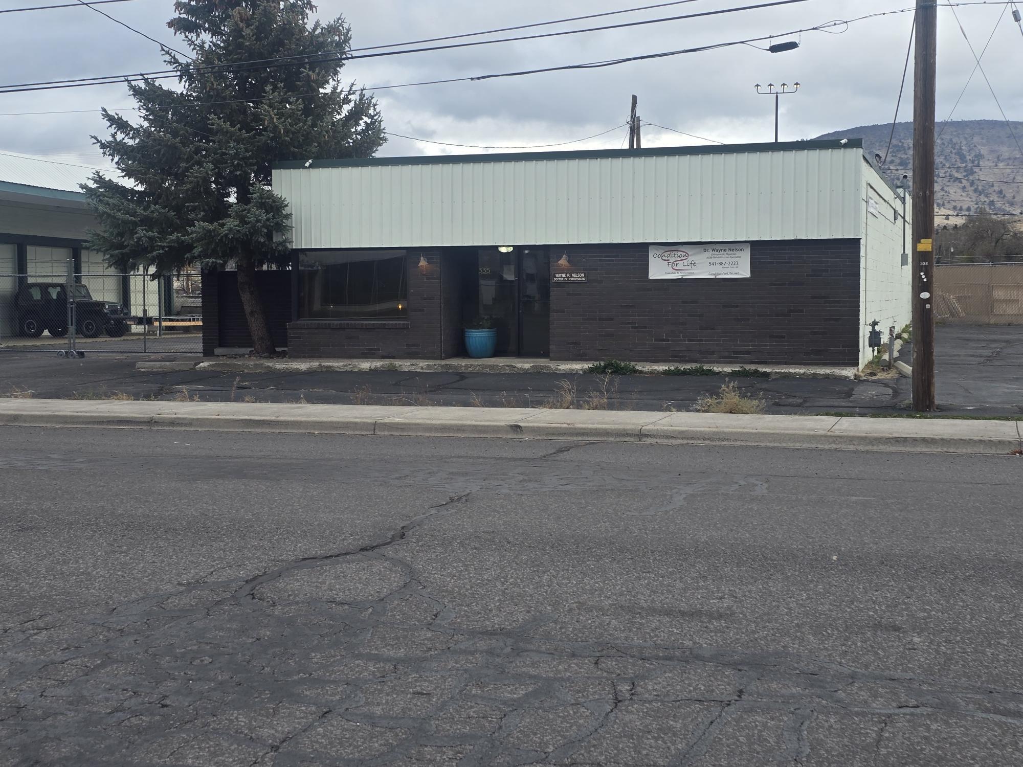 Great opportunity to own a freestanding one level commercial office building near downtown. The interior of this office building has been updated
with fresh paint, and new trim and finishes, and an opened up front reception area. Currently used as a chiropractic office, the building is ideally
suited for any business needing offices, reception and a large open room in the back as flex space. There are currently 3 large office/treatment
spaces as well as an executive office, kitchen, ADA compliant bathroom and laundry room that could be reverted back to a 2nd bathroom. All the work has been done, come and check out this multi use facility. Appointment must be made with listing agent. DO NOT DISTURB THE TENANT.