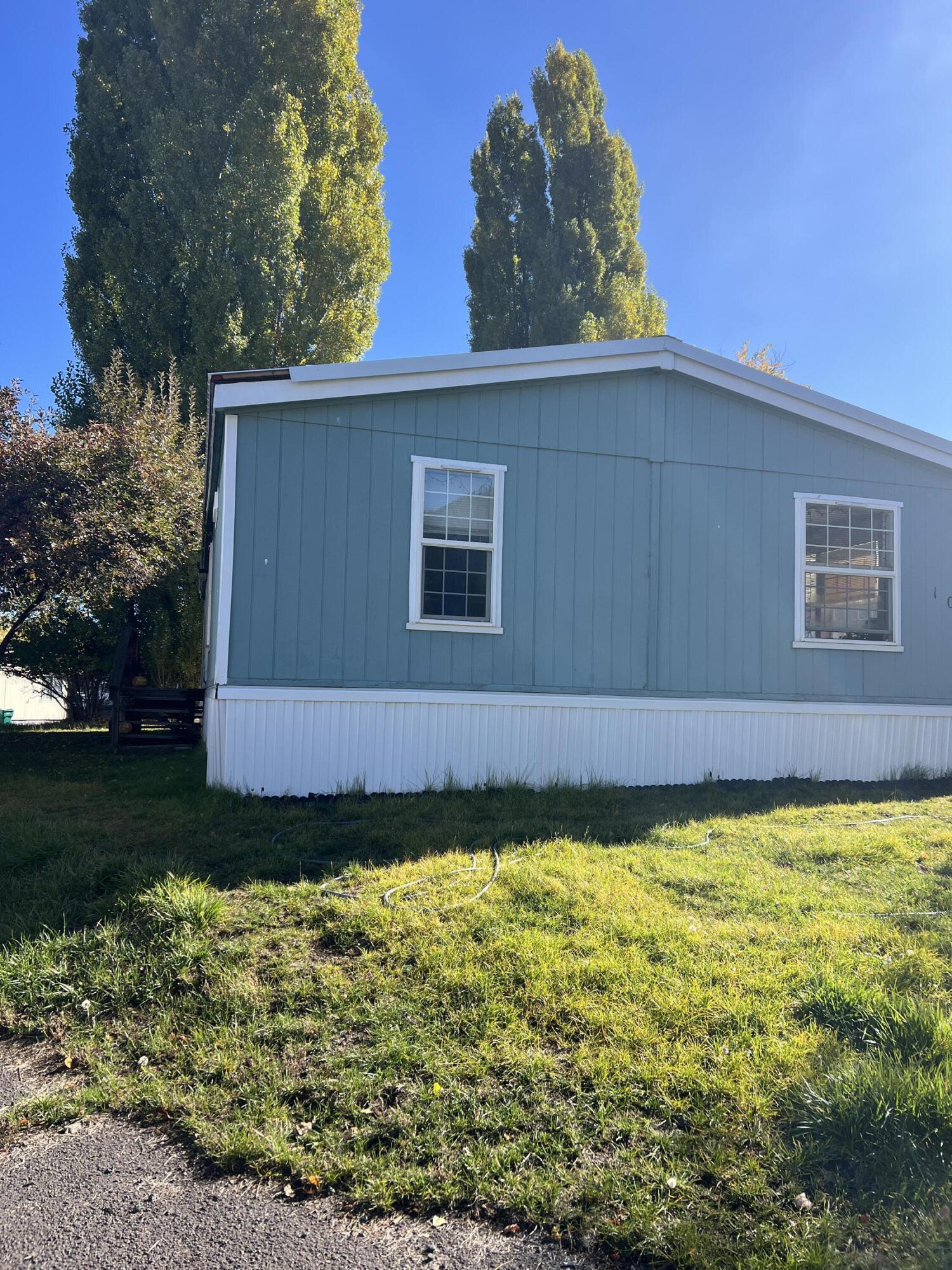This manufactured home in Round Lake Estates has a split floorplan with an open concept layout; the primary bedroom and bathroom on one end and the other two bedrooms and bathroom at the other end of the home. Living room, dining area, kitchen, and family room are spacious, in the center of the house and have great natural light. The metal roof is only 5 years old; appliances are about three years old and there is a pellet stove and ductless heat/AC unit for year round comfort. Some upgrades have been completed but materials are on site for completing a total remodel. The home is in good shape to move right in and then work on various projects as time allows. This is an ''as is'' sale. Make your appointment today.