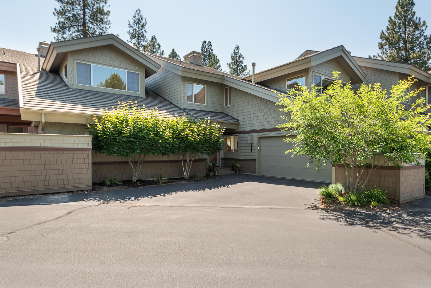 Beautifully updated townhouse at Painted Ridge in Broken Top. Situated on the 10th green, offering stunning views and convenient access to the golf course. 2,043 SqFt of living space, this 3-bedroom, 3 1/2-bath home provides ample room for comfortable living. Open and bright great room, vaulted ceiling with exposed wood beams. Gourmet kitchen boasts high-end appliances and quartz counters. Updated lighting and 5'' hardwood plank flooring. Two primary suites with deck access. Versatile third bedroom located off the loft offers multiple built-ins, including convenient Murphy bed, perfect as an home office or for guests. Private back deck off the main living area, creates a tranquil outdoor oasis, ideal for relaxation or entertaining. As a resident of Broken Top, you have access to miles of scenic trails. Optional membership to golf course, restaurant, sport courts and pool. Exceptional townhouse in Painted Ridge at Broken Top where style, comfort and an active lifestyle merge seamlessly.