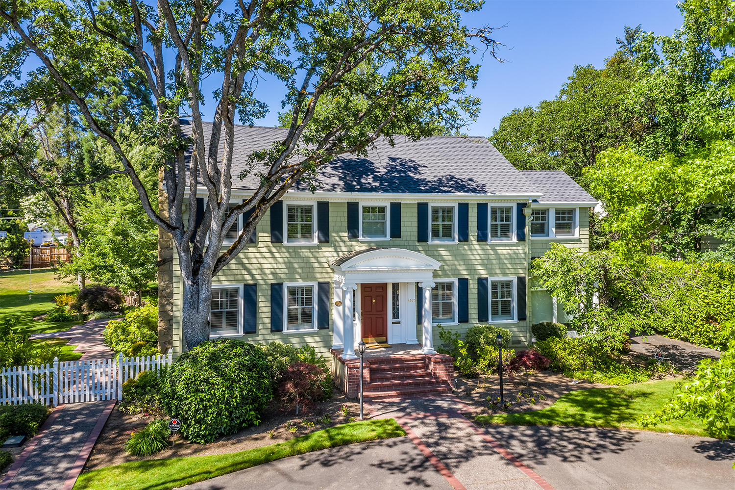 Historic Frank Clark home in the heart of Old East Medford! Built in 1931, as Clark's personal residence, the home today seamlessly blends the grandeur of another era w/meticulous modernization & luxury contemporary living. This iconic property features a harmonious blend of formal & informal living areas w/a spacious & open floorplan, ideal for hosting & entertaining. A picturesque Dutch door welcomes you to a light-filled, open interior w/an elegant staircase, gorgeous hardwood floors & extensive crown molding. The Gourmet kitchen includes an expansive island, butcher block countertop, prep sink, & commercial grade luxury appliances. Amazing master suite w/large walk-in closet, laundry facilities, sitting area, FP & a wall of windows to bring the outdoors IN! Majestic park-like grounds w/a fenced gunite pool, paver patio w/gazebo, sport court, water feature, & circular drive. 2 car garage w/shop & storage space, plus an additional attached one car garage on a separate driveway.