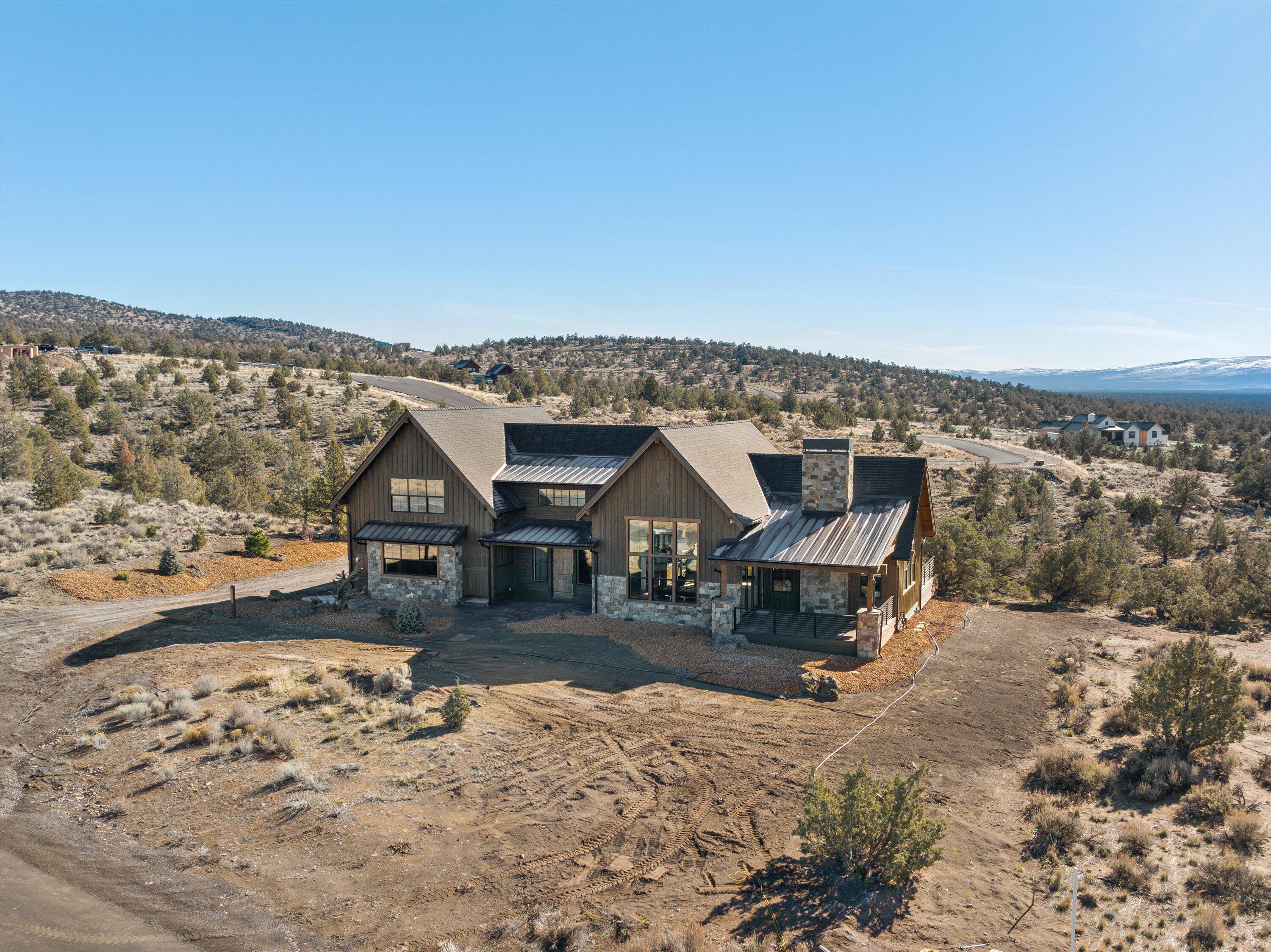 New Construction NW style home accentuated with stone accents and stained wood siding on the exterior. This home offers a modern vibe interior coupled with outstanding Cascade Mountain views from the front deck. The mountain views continue as you enter the home through the expansive windows that are throughout great room, dining area, and kitchen. The kitchen features stainless steel appliances, a large walk-in pantry, slab countertops, and an expansive island, perfect for gathering and entertaining. Beautiful hardwood flooring throughout the great room with a stone fireplace and crafted built-ins. The primary suite is situated on first floor of the home offering a peaceful oasis with a large walk-in closet, oversized soaking tub, and a private deck. This home offers a den/office space, two additional bedrooms with a full bath upstairs. A spacious three car garage complete this home.