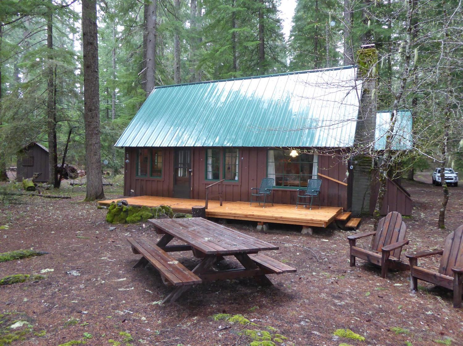 Union Creek cabin with a wonderful location on the Rogue River. The sound of the water and the view of the river are among the best! The same family has owned this for 70 years. This is a seasonal use home on USFS land. Amenities include water from the river, septic, electricity, phone, flush toilet, hot shower, an outhouse and a woodshed. Bring your family and start making memories!