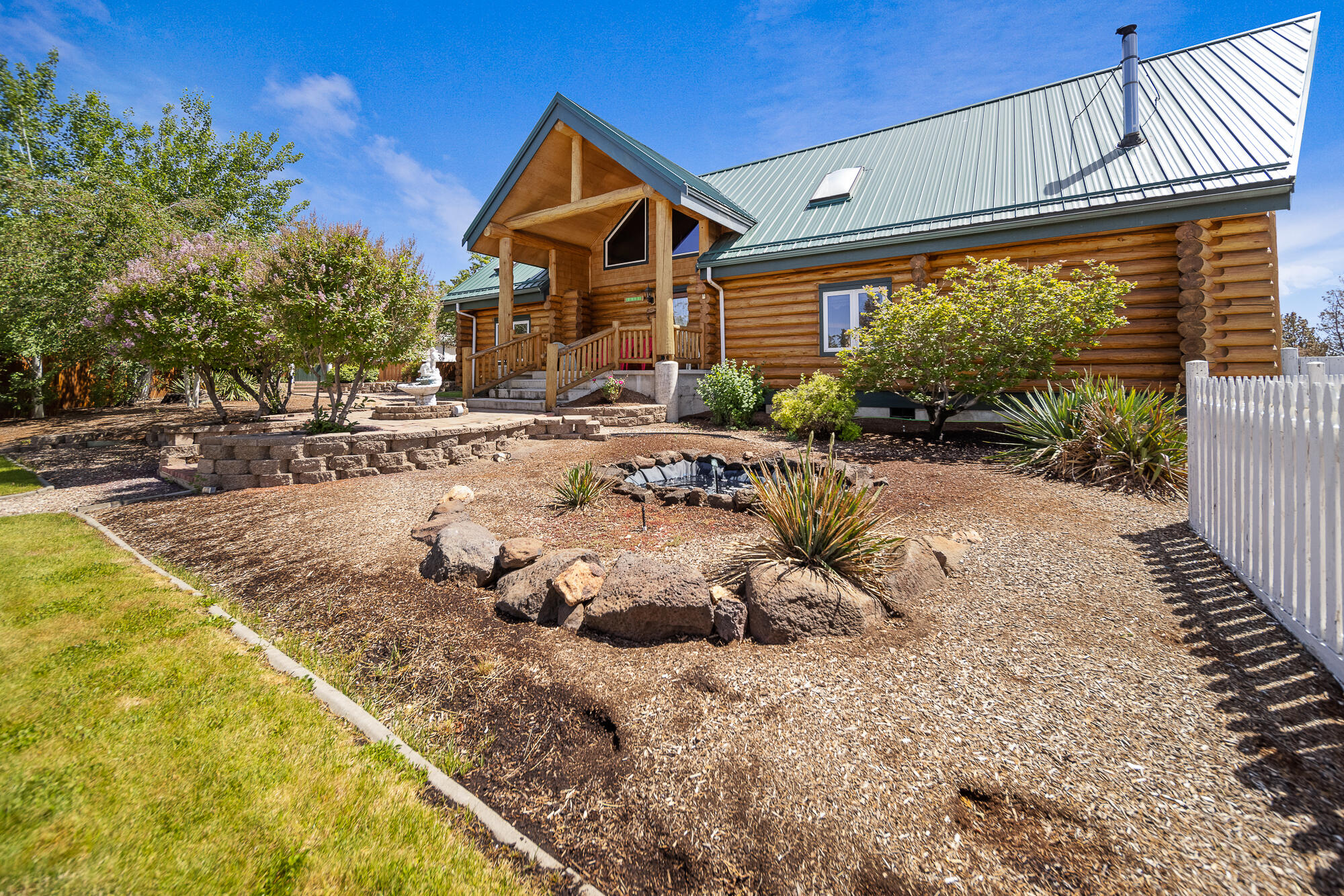 Beautiful custom log home on 10 acres at the end of a private road with Cascade Mountain View. Open great room with floor to ceiling windows to take in the views, large kitchen with island and prep sink and built in flour and sugar bins and desk area, huge laundry room with utility sink, pantry floor to ceiling windows, pull out drawers, laundry chute, and build in ironing board. Two bedrooms and one bathroom on main level, vaulted office/craft room upstairs has a closet and could easily be a fourth bedroom, primary suite is a loft with amazing views of the Cascades, walk in closet and sky light, large bathroom with jetted tub, double vanity, glass block walk in shower & walk through closet. Outside you will find a 1648 sq ft wood shop, fully insulated with bathroom and dust system and an overhang in back for trailer storage, a 36x48 shop with one RV door, a detached double car garage with storage room for gardening supplies and mowers, and a greenhouse. Property is beautifully lands