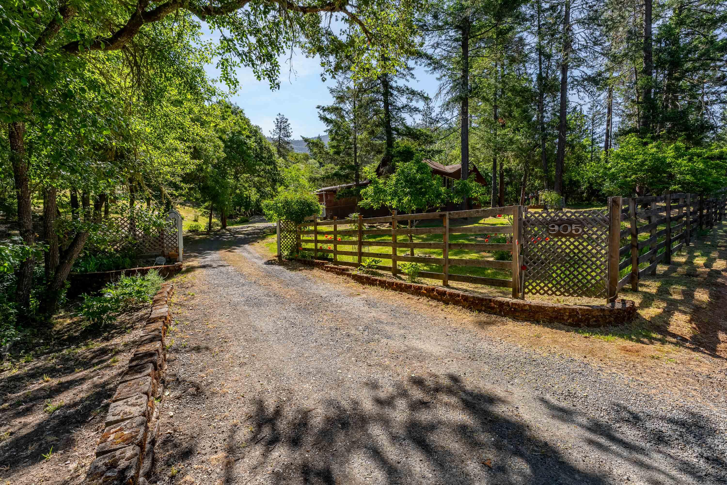 BEAUTIFUL 3 bedroom, 2 full-bath, + 1-bath downstairs in a 1,470SF home in the convenient Cloverlawn Subdivision. An oversized covered porch leads to the front door and LARGE GREAT ROOM with a dual sided wood burning fireplace and picturesque windows for spacious entertaining!! RV parking, driveway swing gate for privacy + 2-car garage, with walk-in access to BONUS ROOM AND BATH DOWNSTAIRS + wide driveway in front for cars and your toys. Light, bright and
cheerful throughout. Kitchen is organized with tile countertops, lots of storage and easy care floors. Schools and shopping, within minutes. rear yard with garden boxes and aviary or chicken coop. Serene and green yard for outdoor entertainment. seasonal creek. Private and Quiet. A tranquil place for the end of your work day or retirement. MOVE IN READY. Don't miss scheduling your tour today.