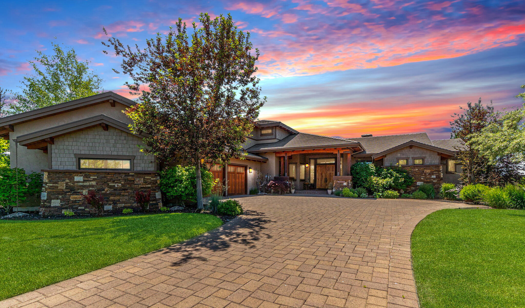 Custom luxury waterfront home w/ breathtaking Cascade Mountain views throughout. Exquisite craftsmanship featuring eco sourced Brazilian cherry hardwood floors, custom rustic cherry doors, elaborate moldings & wood inlay tray ceilings. Modern enhancements such as LED lighting & a fresh, neutral color palette, create timeless sophistication. Main-level living features Primary suite, 2nd spacious en-suite, additional bedroom/office & wine cellar. Chef's kitchen, outfitted w/Miele, Wolf, & SubZero appliances, allows for effortless entertaining. Upstairs boasts a 4th bedroom suite plus bonus room w/kitchenette & deck, providing privacy & versatility. Meticulously landscaped outdoor space features wraparound covered patio, fireplace, fire-pit & built-in BBQ. Huge 3-car garage w/abundant storage. Nestled in a prestigious gated resort community renowned for year-round recreation, experience luxury living in a top 100 international golf resort destination. List price is below appraisal