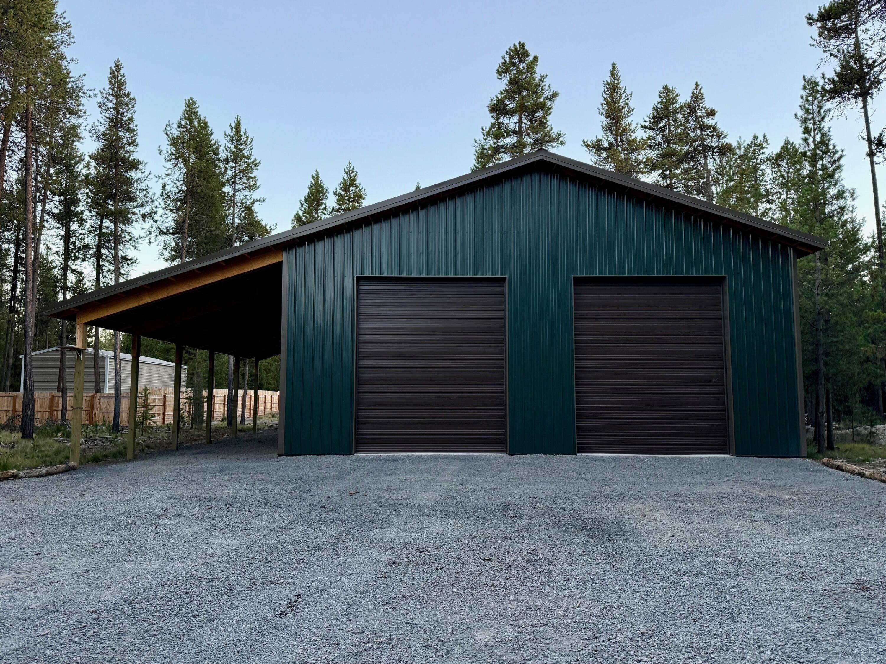 BRAND NEW! Just completed and ready for you. All the custom features needed for the best price. Currently being fully insulated and wrapped, 8' OSB all the way around on the bottom. HUGE 16' overhang, High quality garage door openers. RV Plug, Welder plug, Extra Bright lights, Door out the back as well. Nicely situated on a half-acre lot with nice trees for privacy. The large driveway is great for getting your RV in or out as well as all the toys. Oversized 16' overhang also gives plenty of additional space. 200-amp service with several outlets, RV plug and welder plug, very bright lighting. Location is great and very close to the deeded boat ramp to throw the paddle boards in, or just enjoy the Big Deschutes River. Close to all the lakes, Mt Bachelor, and the amenities of Sunriver. Custom built large shop on recreational lot. 40x50.