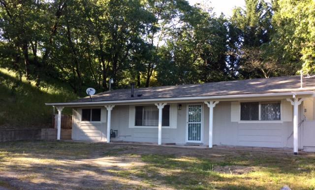 Beautiful city views await you at this private home in town. It is the last house on a dead end street and backs up to county property. This freshly painted 1344 sf home has 3 bdr. And 1 bath. 3rd bedroom was a garage conversion and could also be used as a bonus/family room. The living room has laminate flooring and a gas fireplace. New carpet in 2 of the bedrooms and a $900 flooring allowance for the 3rd bdr/bonus room. A sliding glass door opens onto the private patio with a terraced fully fenced back yard. There is a nice wooden shed in the backyard for storage. Roof and heat pump are only 3 years new. This home is as cute as a button and has a lot of potential.