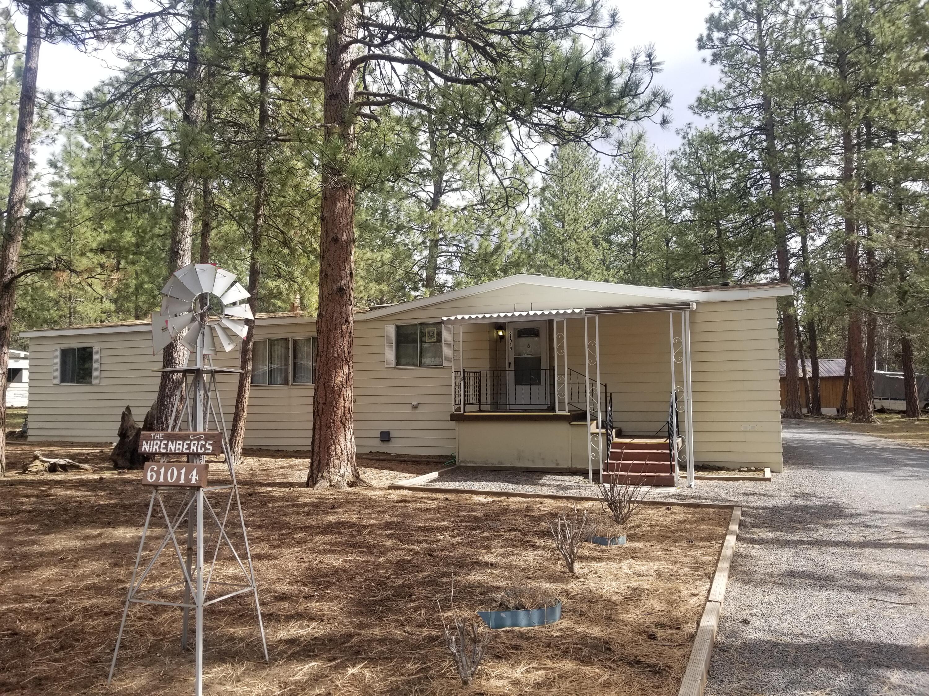Enjoy living in nature, in a spacious  3 bedroom, 2 full bath, single level, privacy, close to Old Mill, downtown, trails, on a .33 acre level treed lot, Large 2 car garage detached with one tall door. RV parking with level gravel driveway. Bright kitchen with skylight and a Solar tube in  second bath. Sliding door leads to covered deck. Main level master with walk-in closet and on-suite bath Spacious dining area.
Get cozy next to freestanding gas fireplace new in 2012 or flip on the A/C. Tons of storage/closets, built-ins. One bathroom has a step-in shower,
New roof 2019. Manufactured home subdivision with Clubhouse and Pool. Small HOA fee.