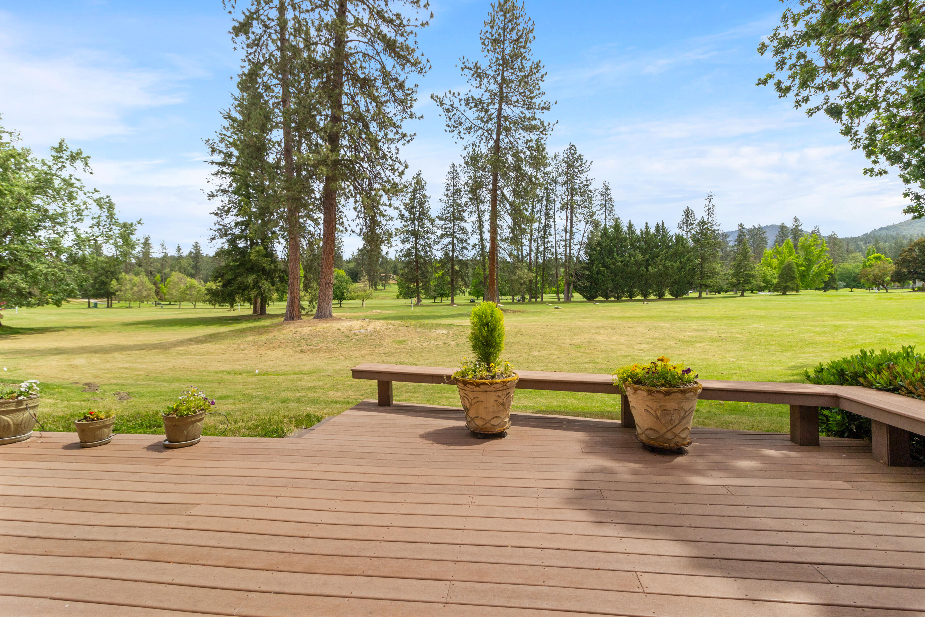 Embrace the opportunity to live in this unique home which combines both leisure and the beauty of nature, all within the welcoming setting of the Grants Pass Golf Club. Discover this spacious, custom-built single-story home, perched to overlook the driving range of the Grants Pass Golf Club in Southern Oregon. Look no further if you're seeking a serene golfing retreat. This home invites you to unwind on the extensive deck, where you can watch the squirrels and geese after a day on the golf course. Golf Course Access - direct private golf cart path to the course. Garage w/ built-in storage, and ample space, plus third garage door bay to store a golf cart. Unique layout, thoughtfully designed to offer spacious and comfortable living! Wonderful proximity to nature and close to the scenic Cathedral Hills hiking trails. This lovely property offers an ideal balance of comfort and practicality. Seller financing option avail w/ $250k down, financed at 4.5%.