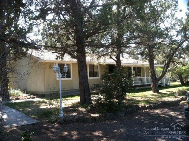 10-AC w/4 AC COI flood IRRIG & 3 ponds. 2 homes, main 1-story house is 1344 sq ft modular w/vinyl windows & laminate wood floors. Includes a handicap ramp, glass top range, D/W, micro, pellet stove, ceiling fan & lg covered front porch, The vacation cabin is a 2-story home w/1296 sq ft. Each level has a separate entrance, bathroom, bedrooms & kitchen. Main house has spacious enclosed sunroom/porch patio. The garage/shop is 24X24. There is a chicken coop, well house, greenhouse, large shed and more....