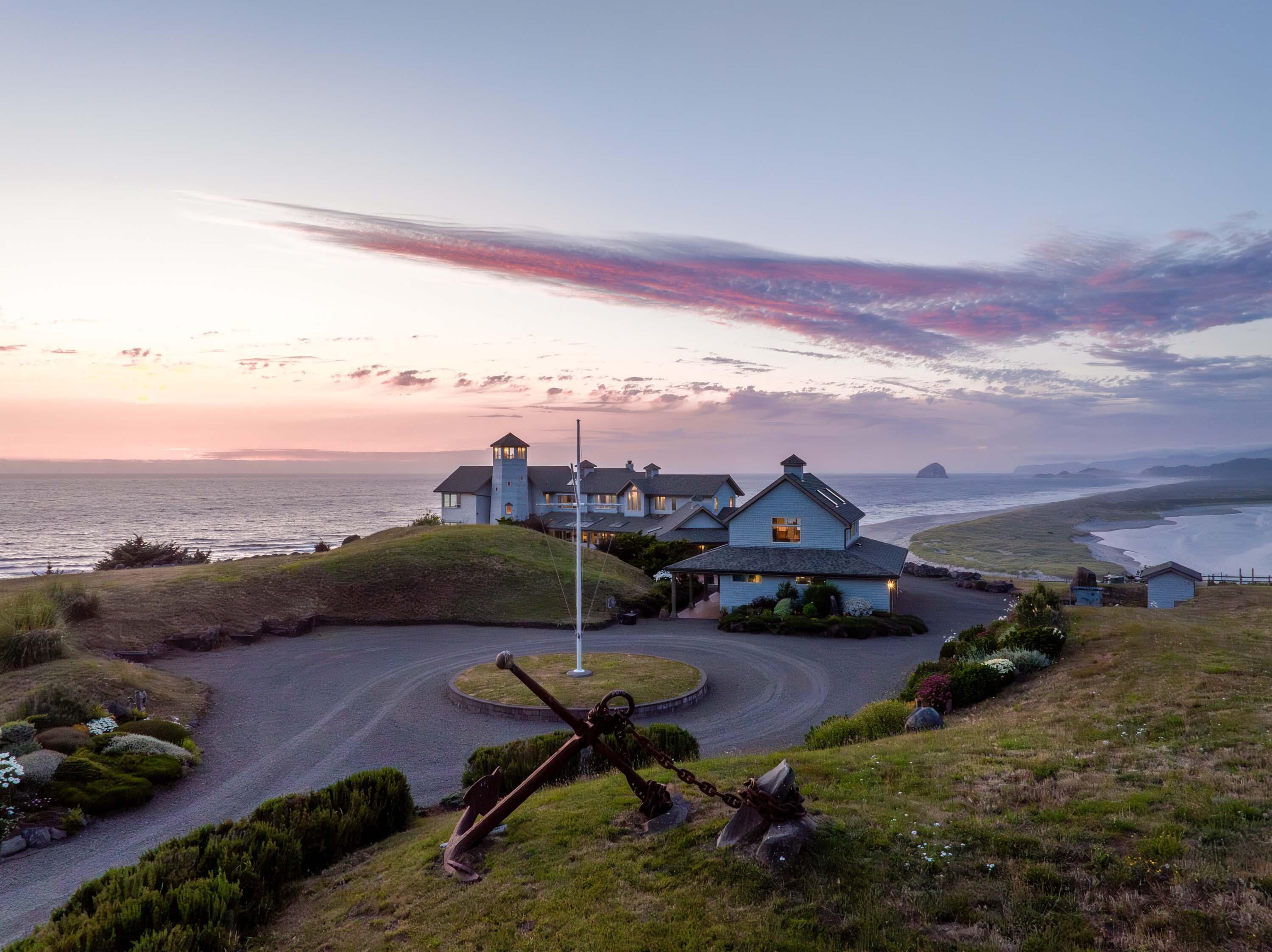 Auction: list price is bidding start price and may differ from seller's reserve. AUCTION BIDDING OPEN: Bidding ends May 16th. Previously Listed $10M. Current High Bid $3.4M. No Reserve. Showings Daily By Appt. - Ocean and river views as far as the eye can see beckon from the Central Oregon Coast. Enjoy a private oasis surrounded by windswept grasses, rocky beaches, and unobstructed views of sea stacks rising from the ocean. Nearly every interior wall offers abundant windows that frame those same views for the ultimate coastal sanctuary. The most memorable and unique place to take in the incredible scenery is the viewing room at the top of a grand circular staircase lined with mahogany. With plenty of space for family and friends, including a fisherman's cottage with private river access and a separate guest house, this will be your favorite place to marvel at the wonder of nature amongst the people you love.
